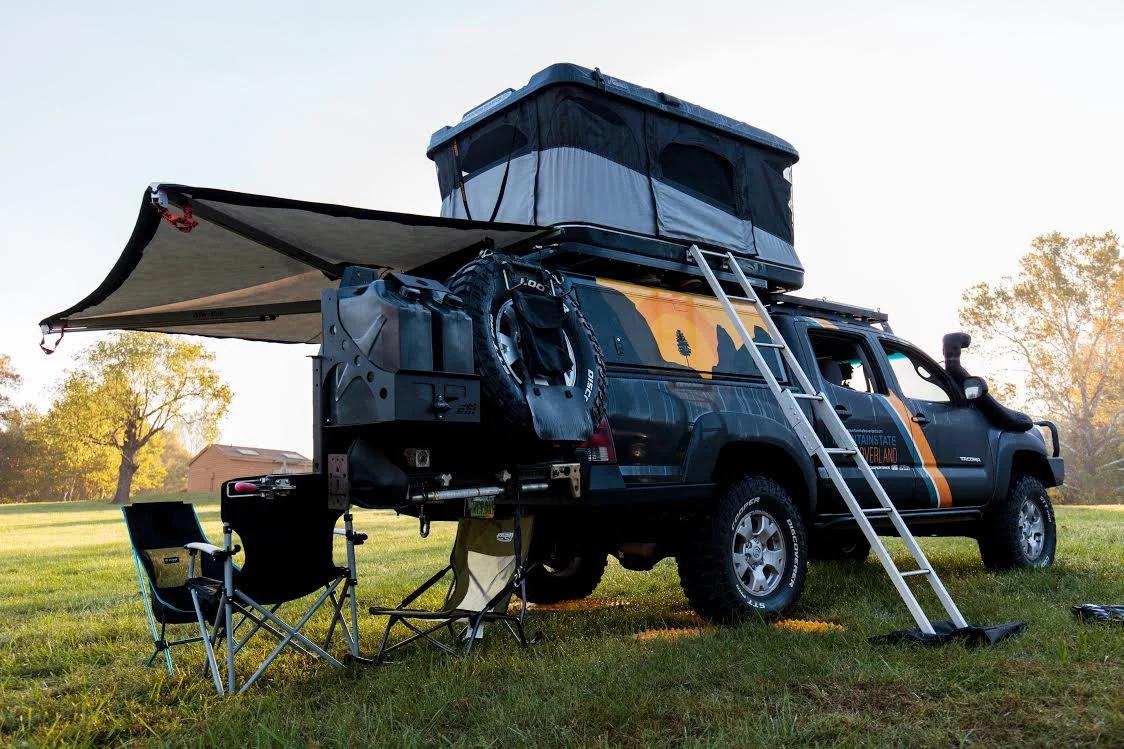 A rooftop tent mounted on a vehicle's roof, the load whose weight must stay within the roof's dynamic limit