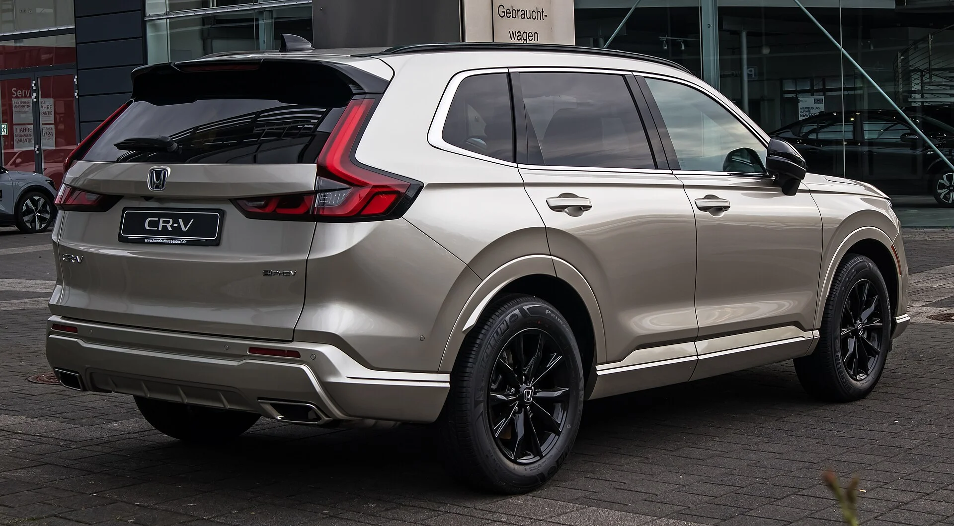Silver Honda CR-V, current generation, rear three-quarter view