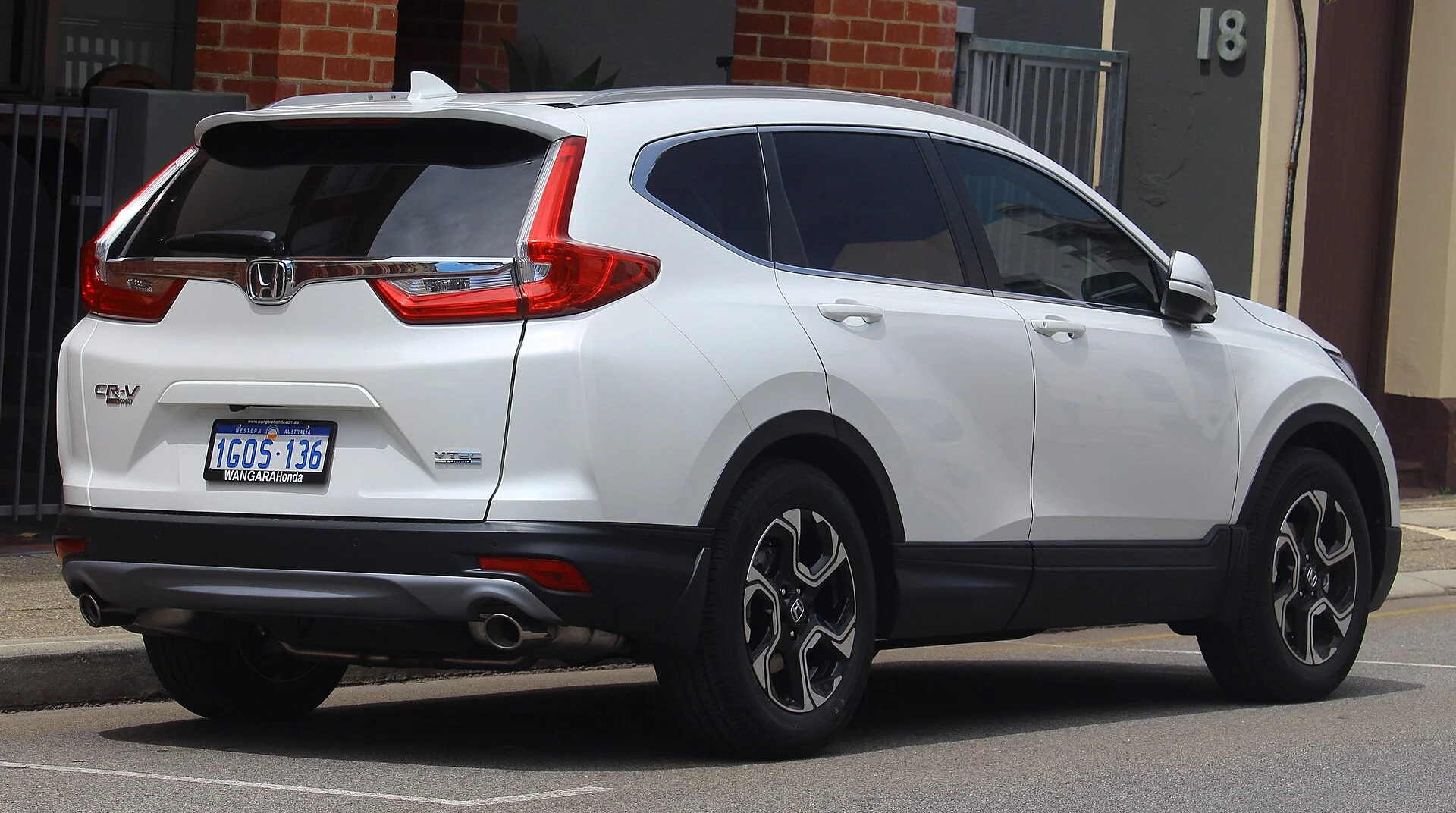 White Honda CR-V, rear three-quarter view showing the roofline