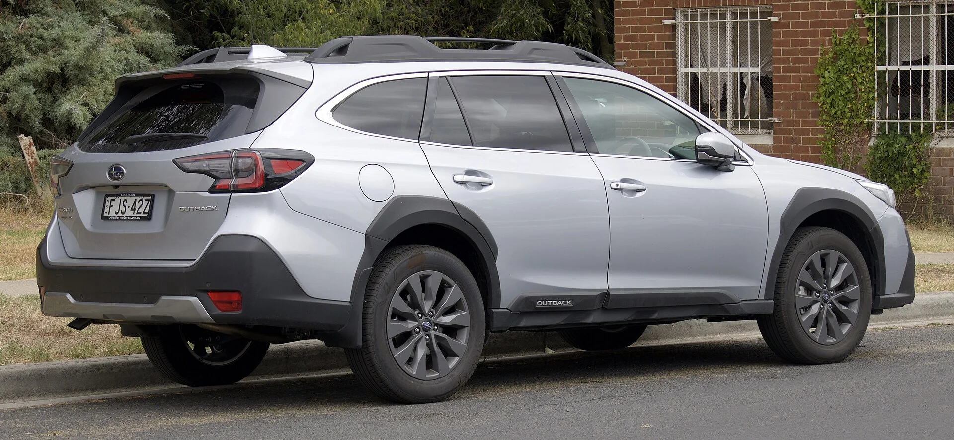 Silver Subaru Outback, current generation, rear three-quarter view