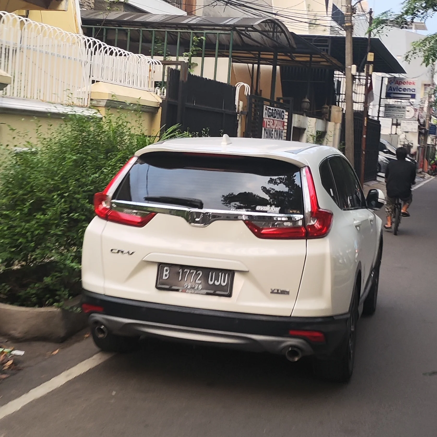 White Honda CR-V, rear view showing the liftgate