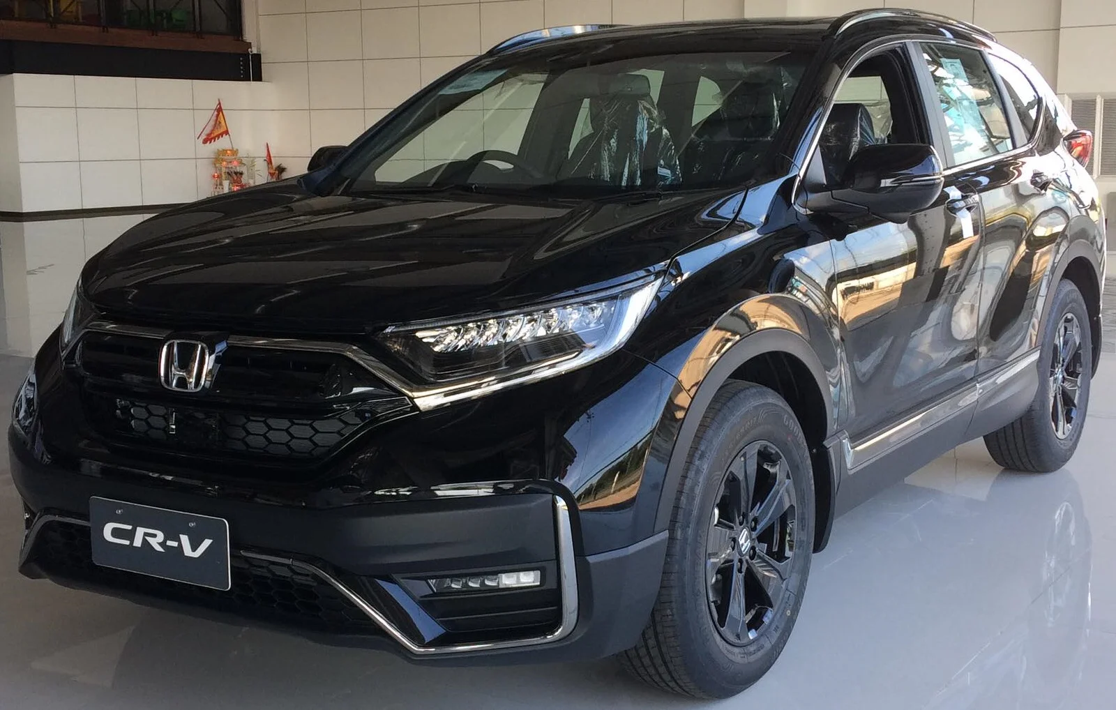 Black Honda CR-V, current generation, front three-quarter view