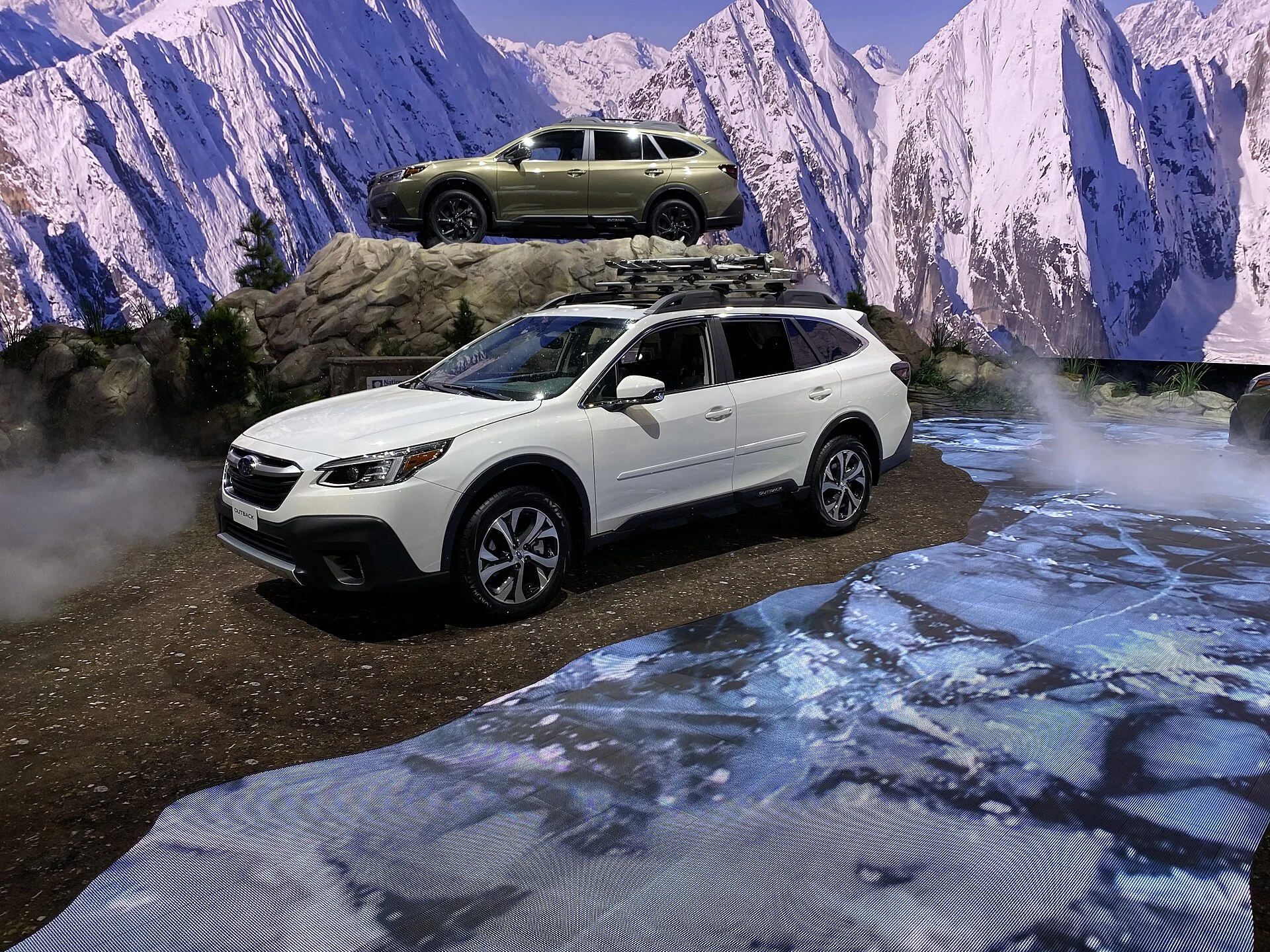 White Subaru Outback, current generation, front three-quarter view