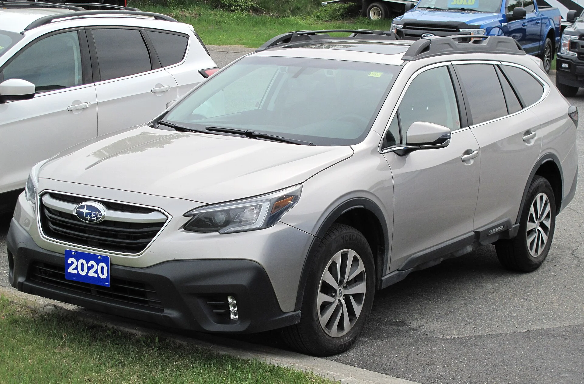 Silver Subaru Outback, current generation, side view