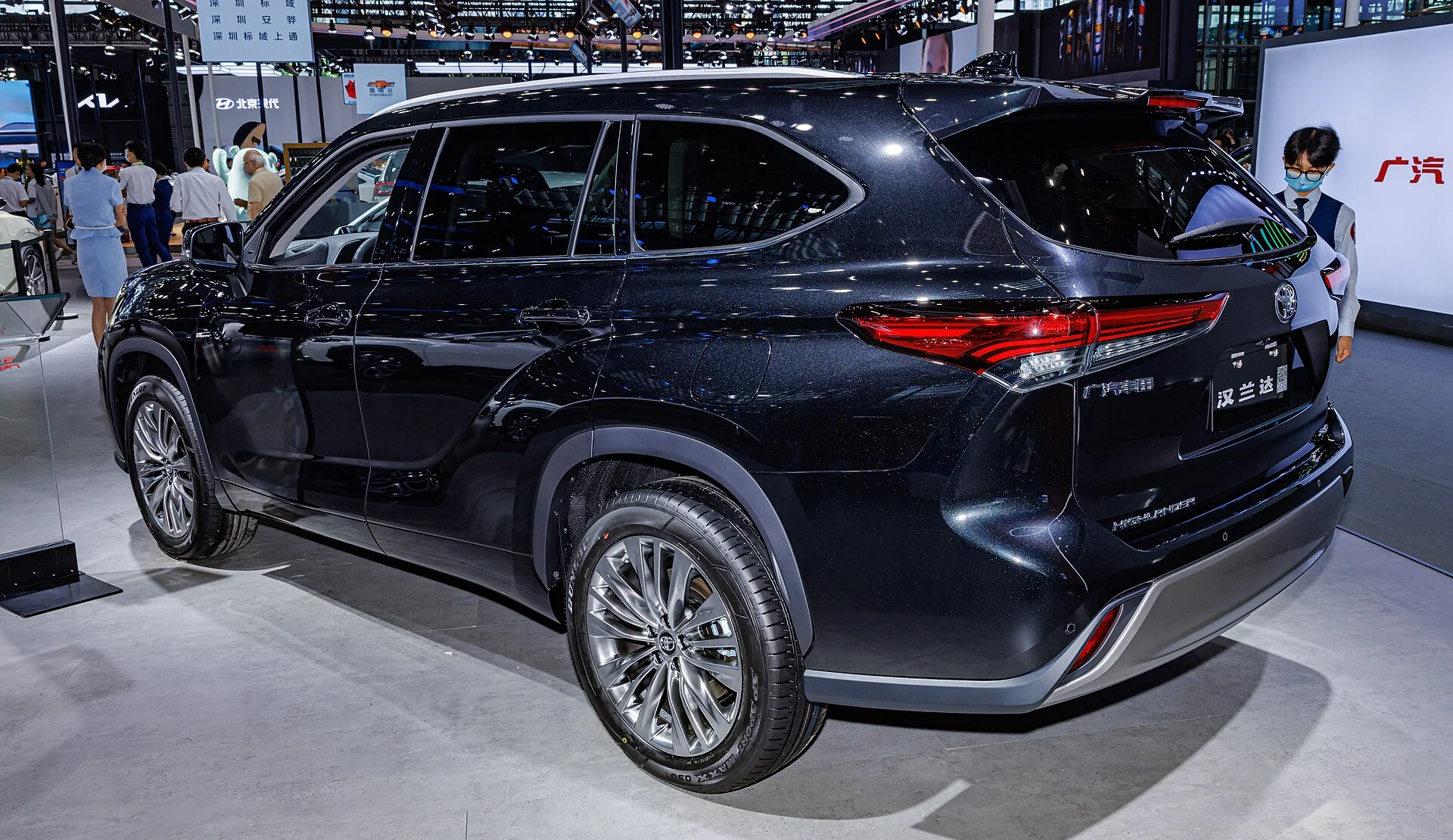 Black Toyota Highlander, current generation, rear three-quarter view