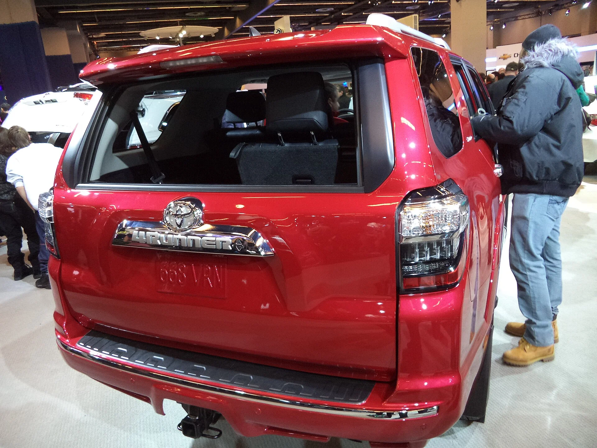 Red Toyota 4Runner, rear view showing the liftgate and roofline