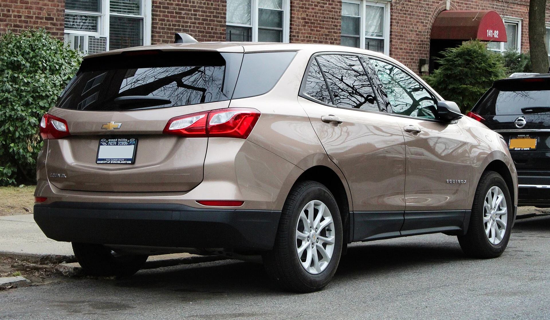 Tan Chevy Equinox, current generation, rear three-quarter view