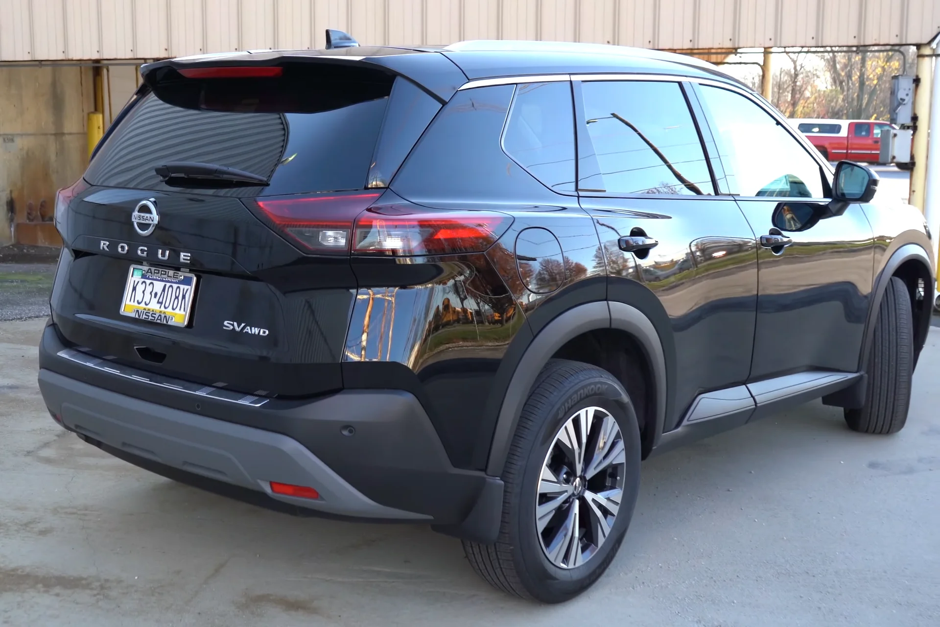A black Nissan Rogue showing the rear cargo area