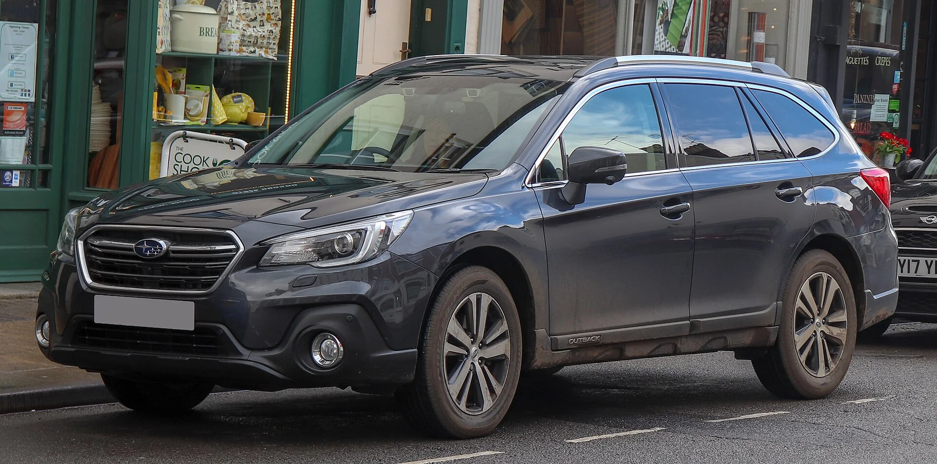 Subaru Outback (2018) in dark grey, front three-quarter view