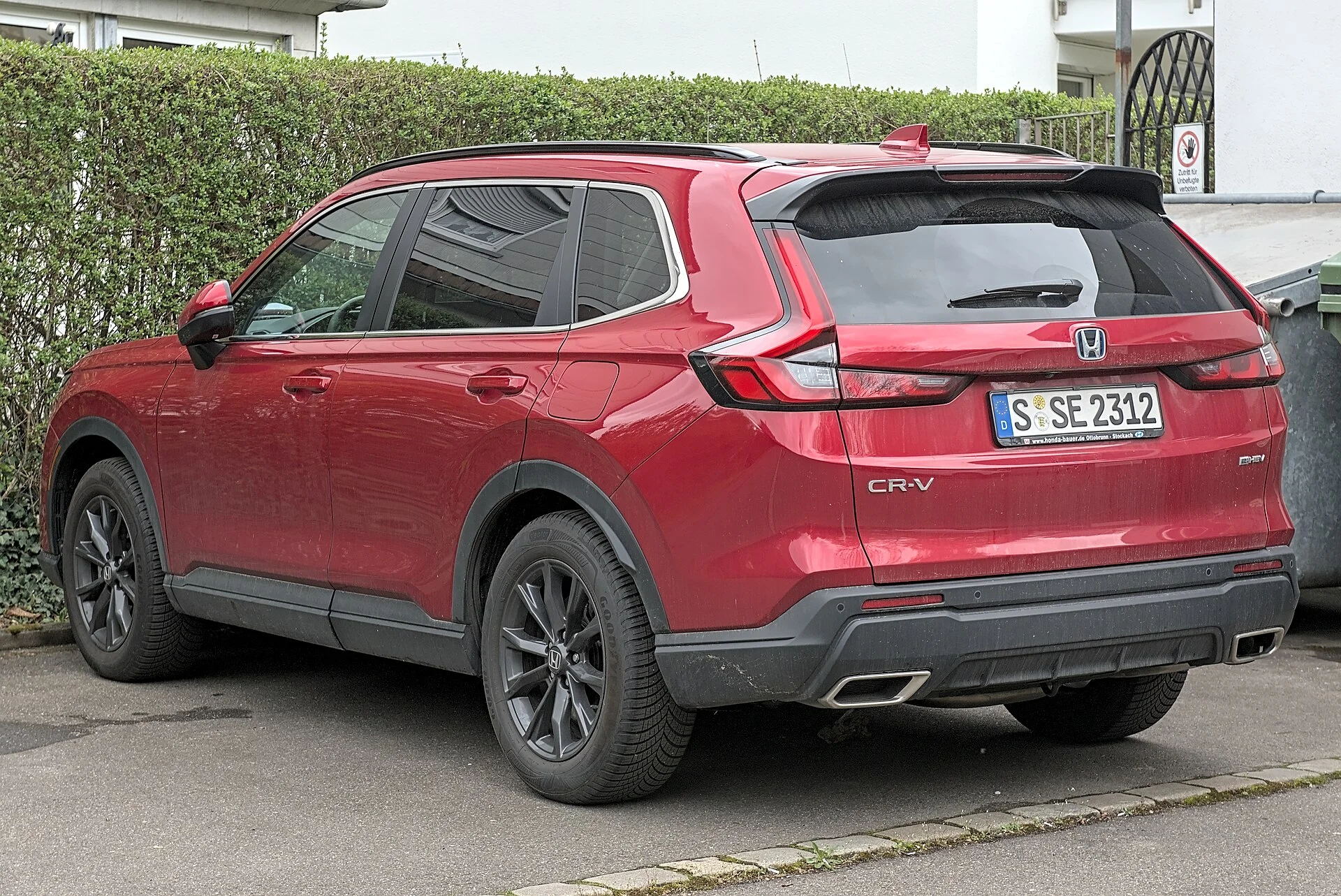 Honda CR-V (6th generation) in red, rear three-quarter view