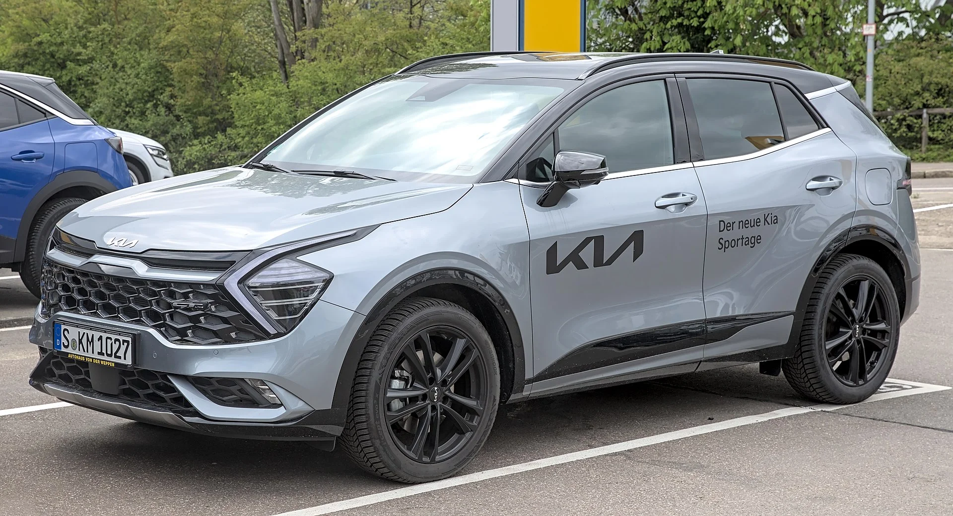 Grey Kia Sportage, current generation, front three-quarter view