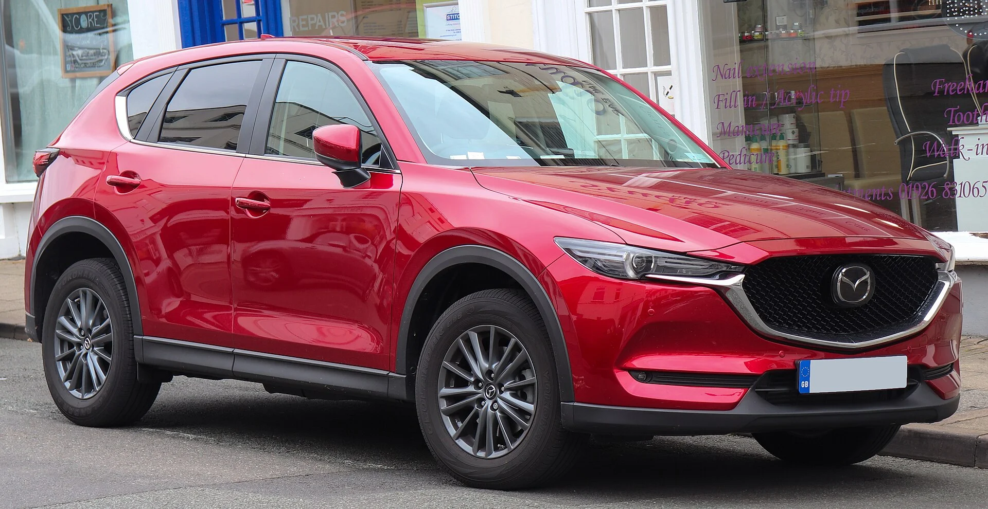 A red Mazda CX-5 for a rooftop tent build