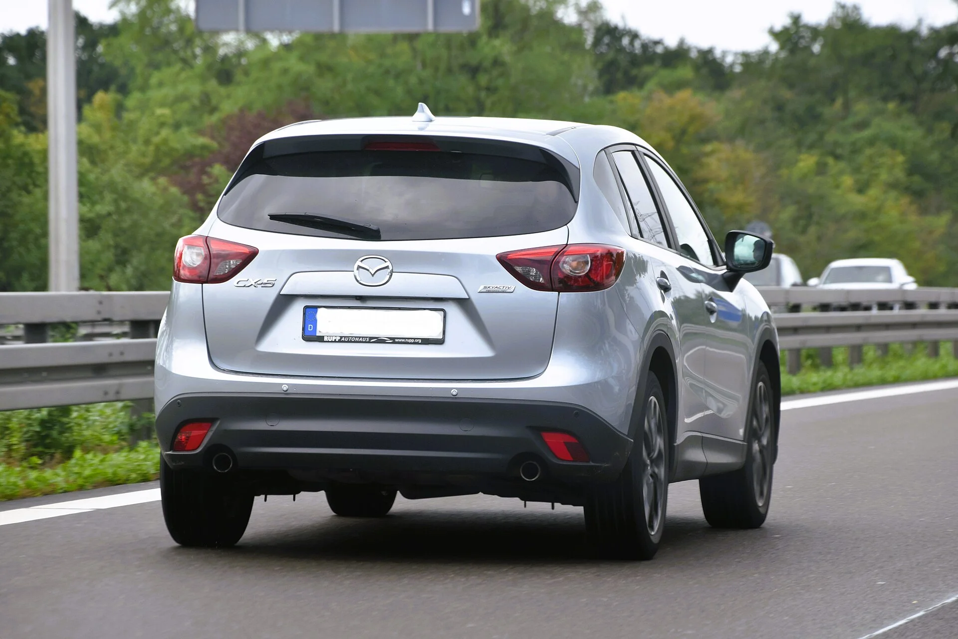 A silver Mazda CX-5 seen from the rear