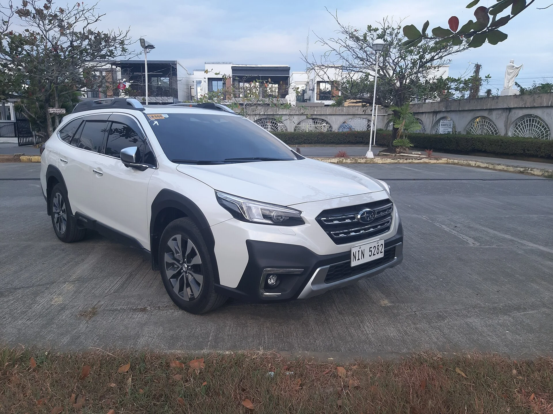 A white Subaru Outback, a common rooftop tent host