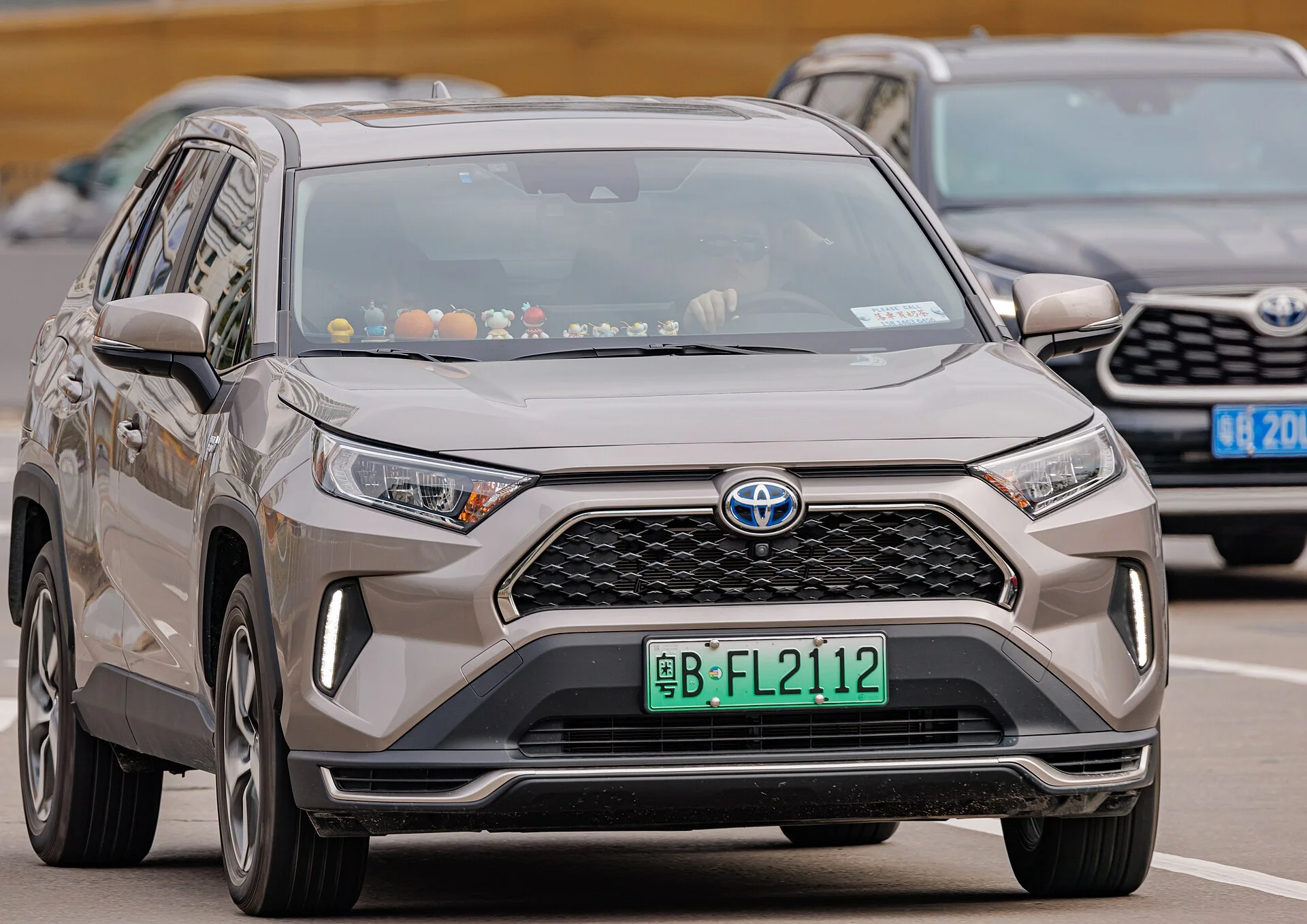 Bronze Toyota RAV4 Prime plug-in hybrid, front three-quarter view