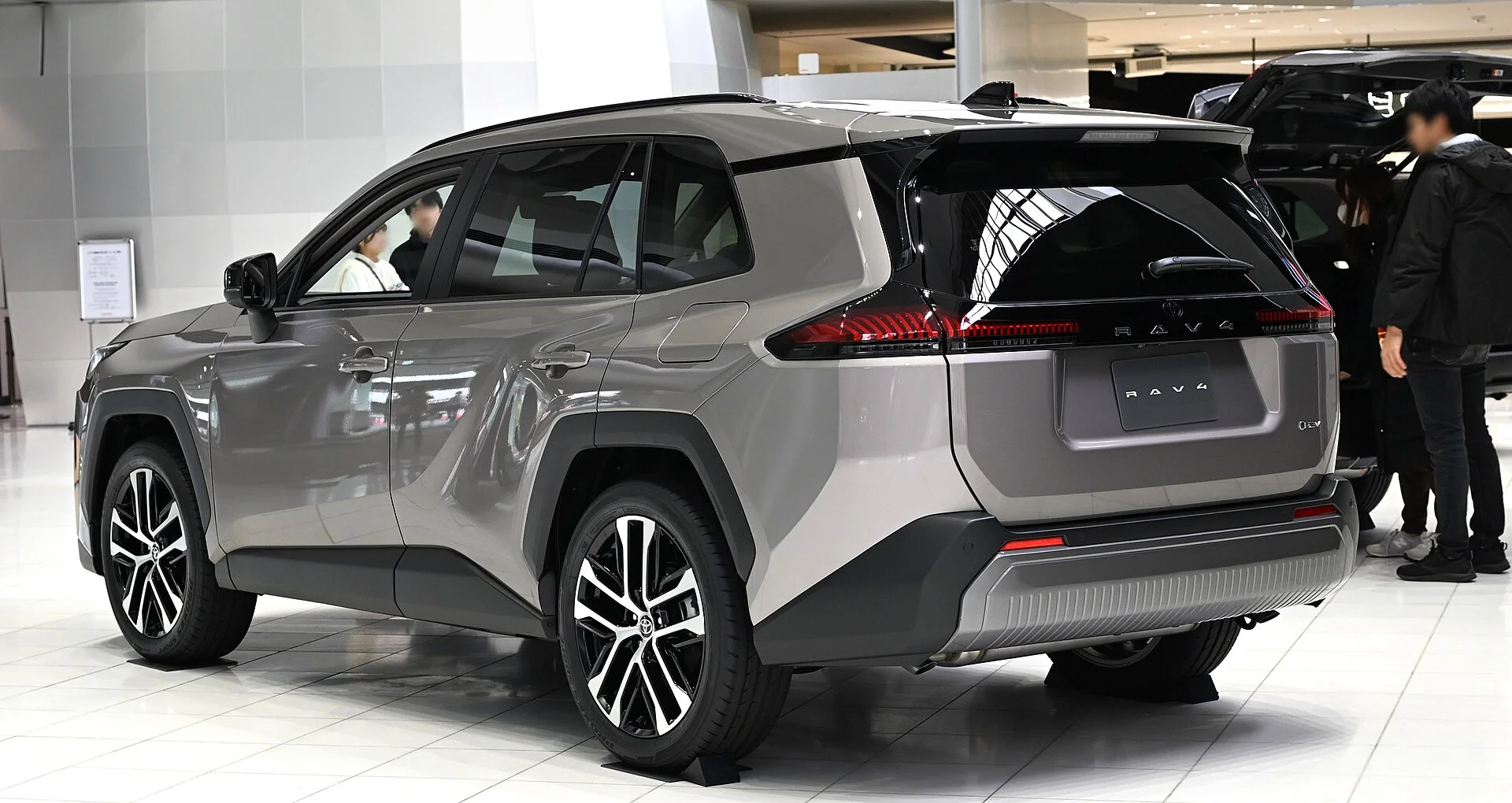 Grey Toyota RAV4, rear three-quarter view