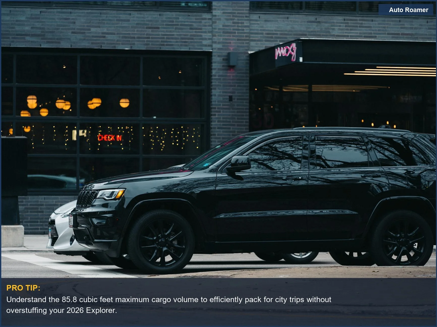 Black 2026 Ford Explorer parked on a city street, showcasing its refined design and generous cargo capacity for urban use.