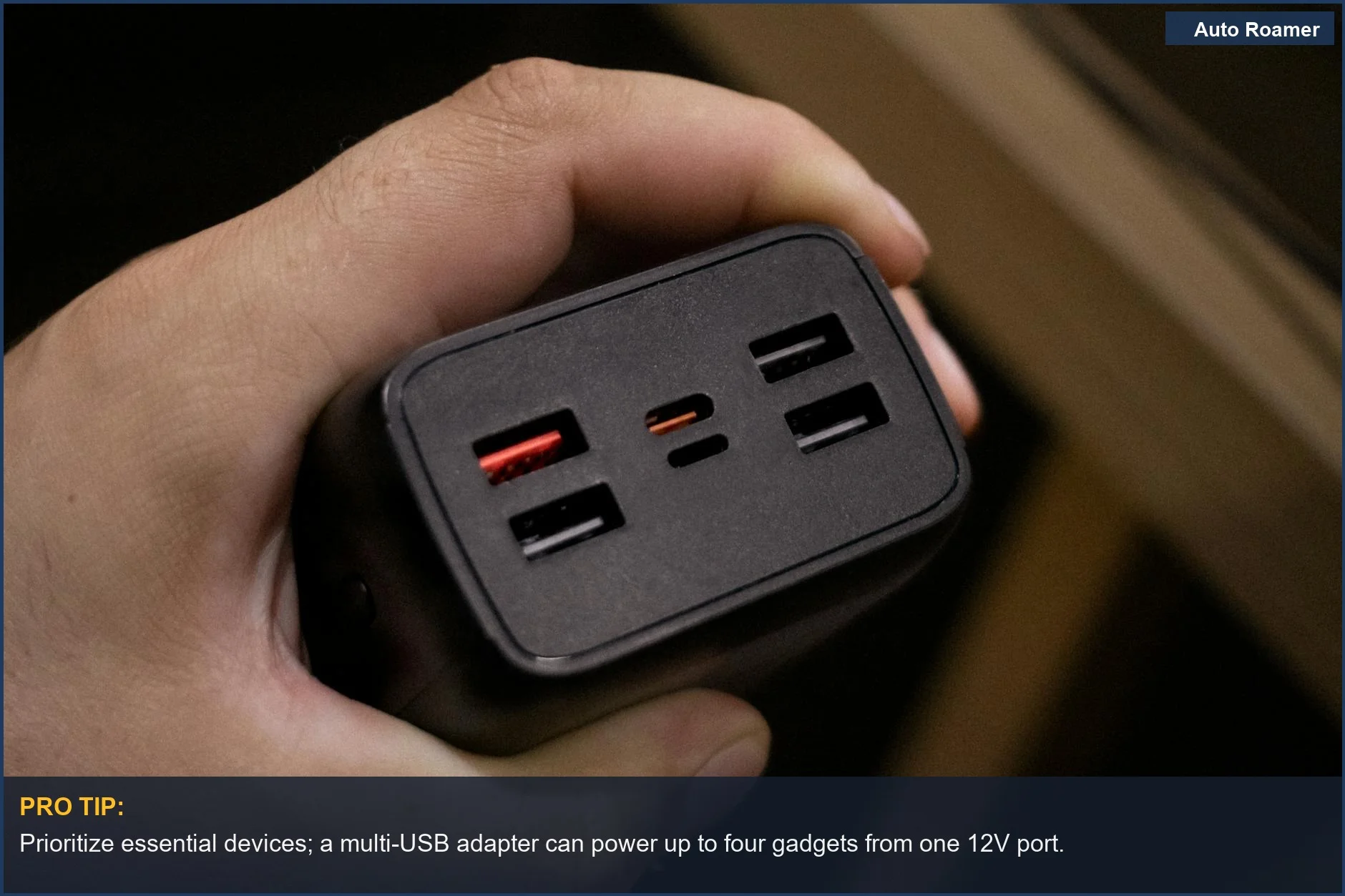 Hand holding a multi-USB port power adapter, a versatile accessory for Tesla Model Y car camping power.