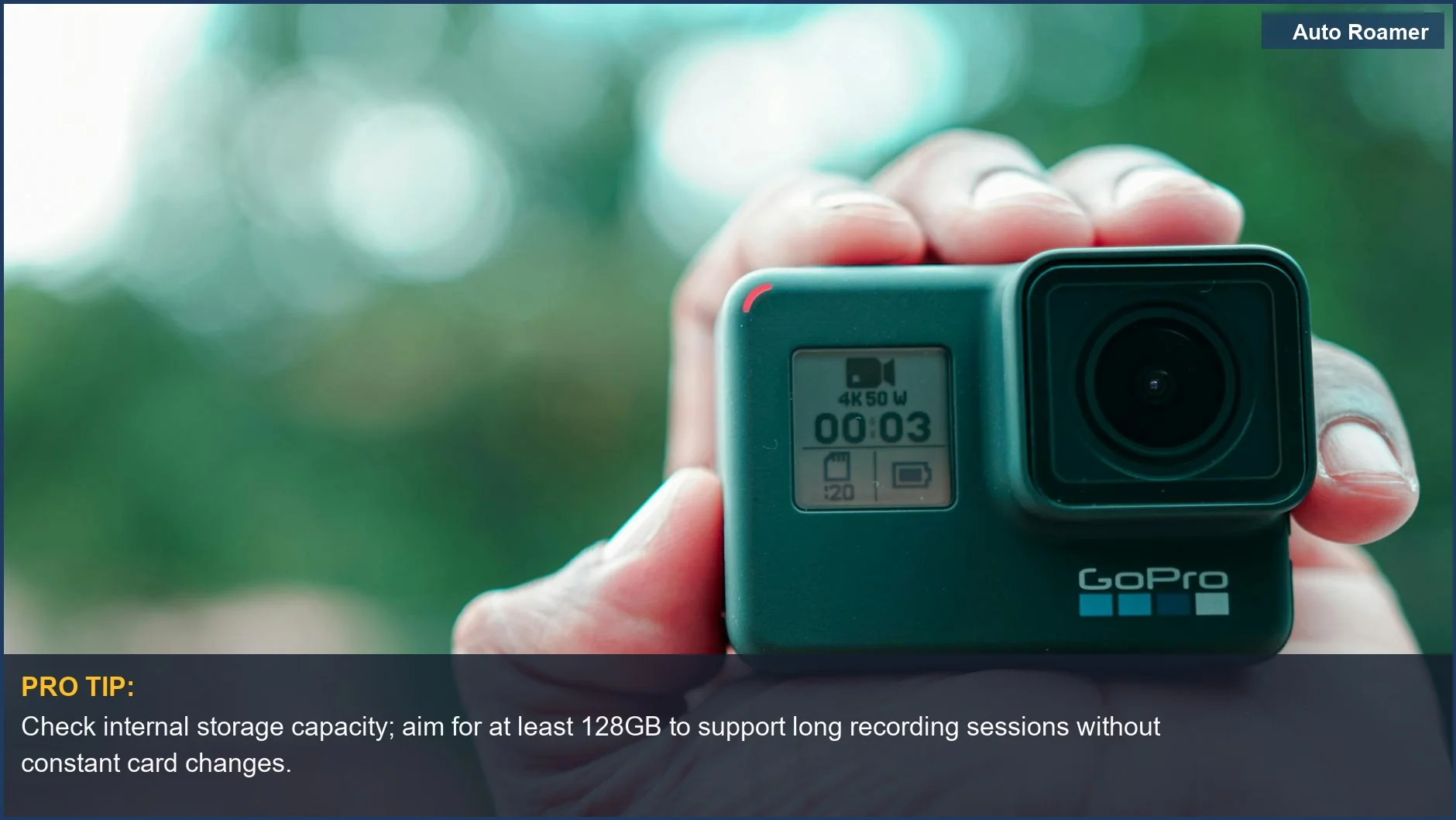 Close-up of a hand holding a compact action camera, ready for extended recording sessions.