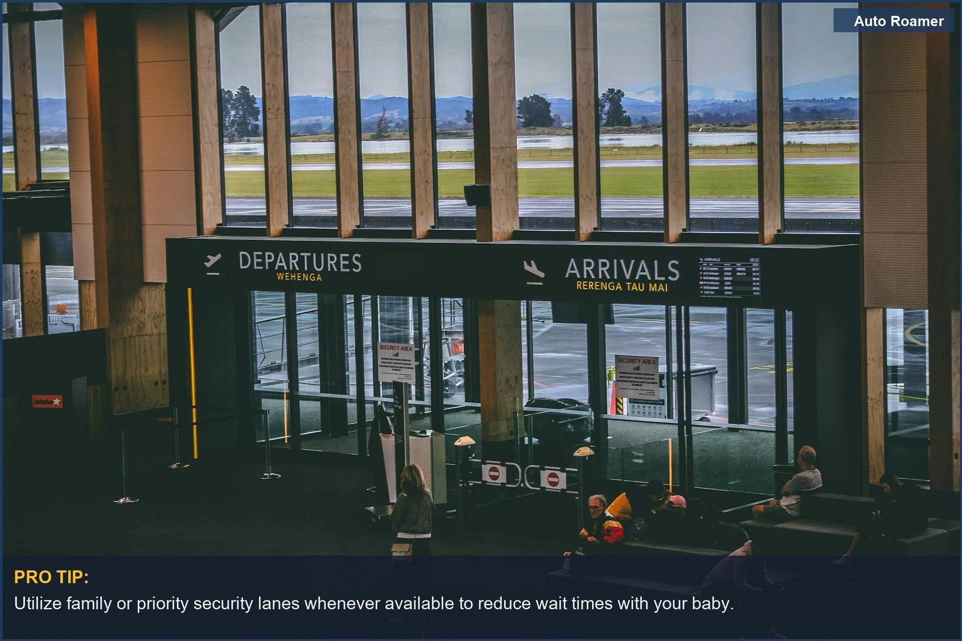 Busy airport departures and arrivals board, showing signs for passengers flying with baby.