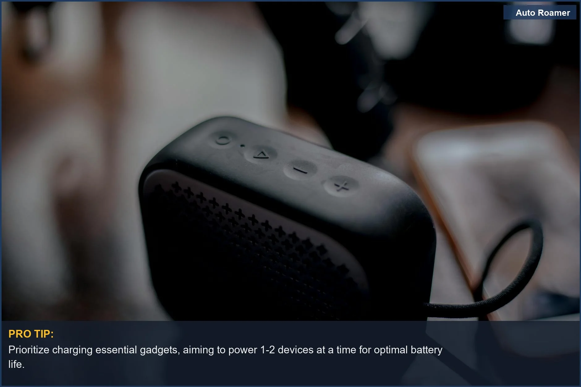 Bluetooth speaker and smartphone on a wooden table, demonstrating modern tech and camping appliance power.