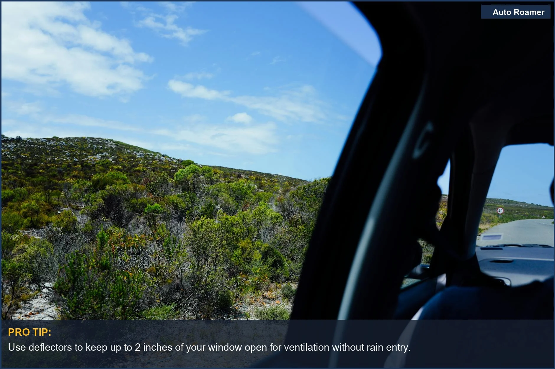 Scenic landscape viewed through a car window, showcasing the appeal of car window deflectors for outdoor enthusiasts.