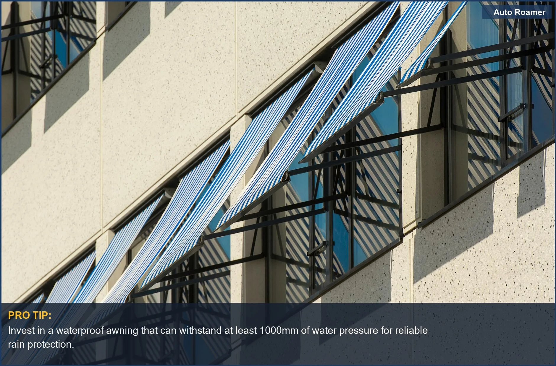 Close-up of waterproof awning fabric in blue and white stripes on a contemporary building.