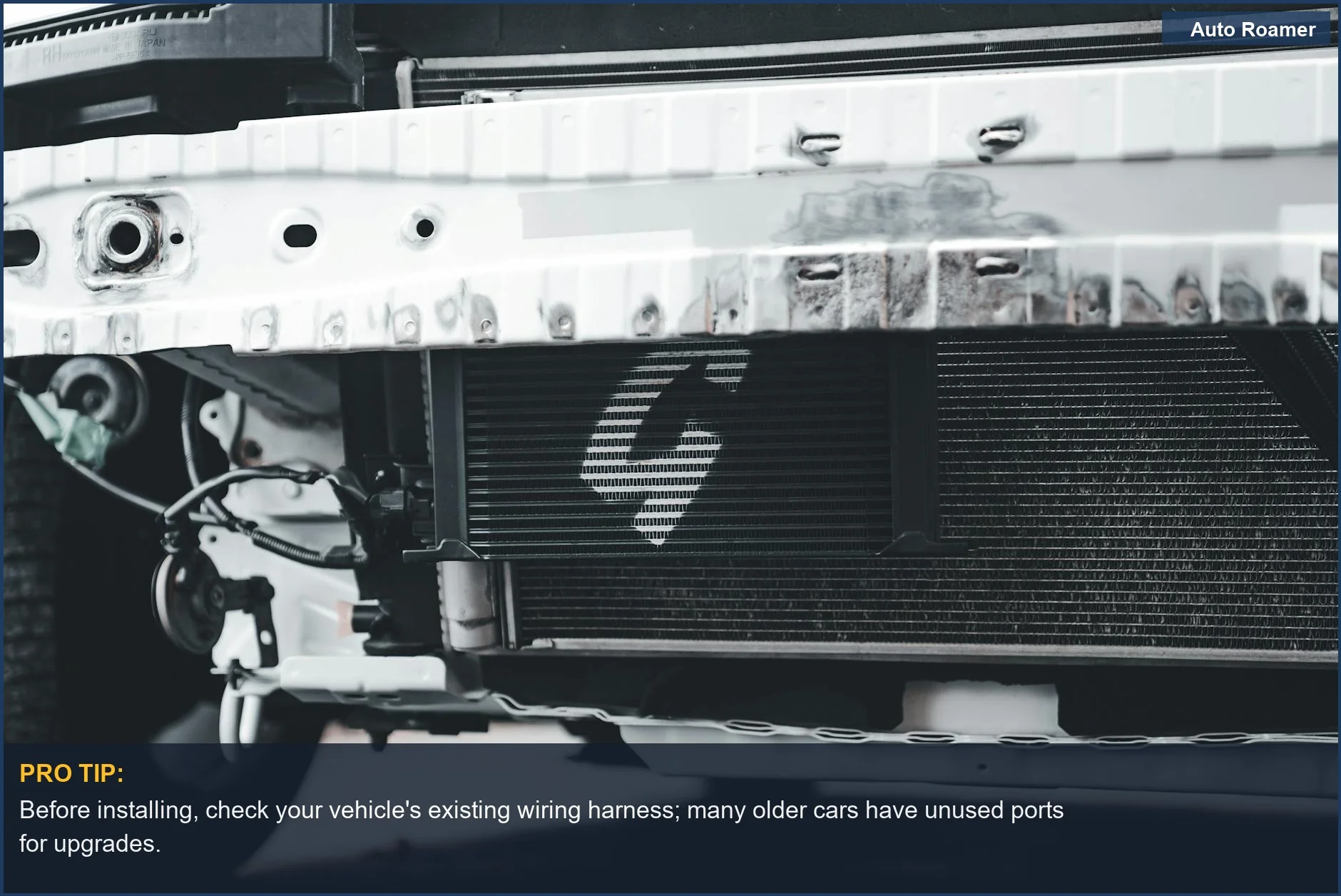 Detailed image of a car radiator and front bumper, emphasizing mechanical components relevant to car upgrades.