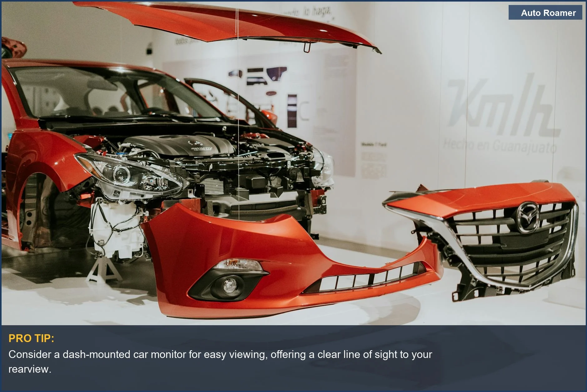 Explore a red Mazda 3 at an auto exhibition, highlighting its interior and potential for an aftermarket backup camera.