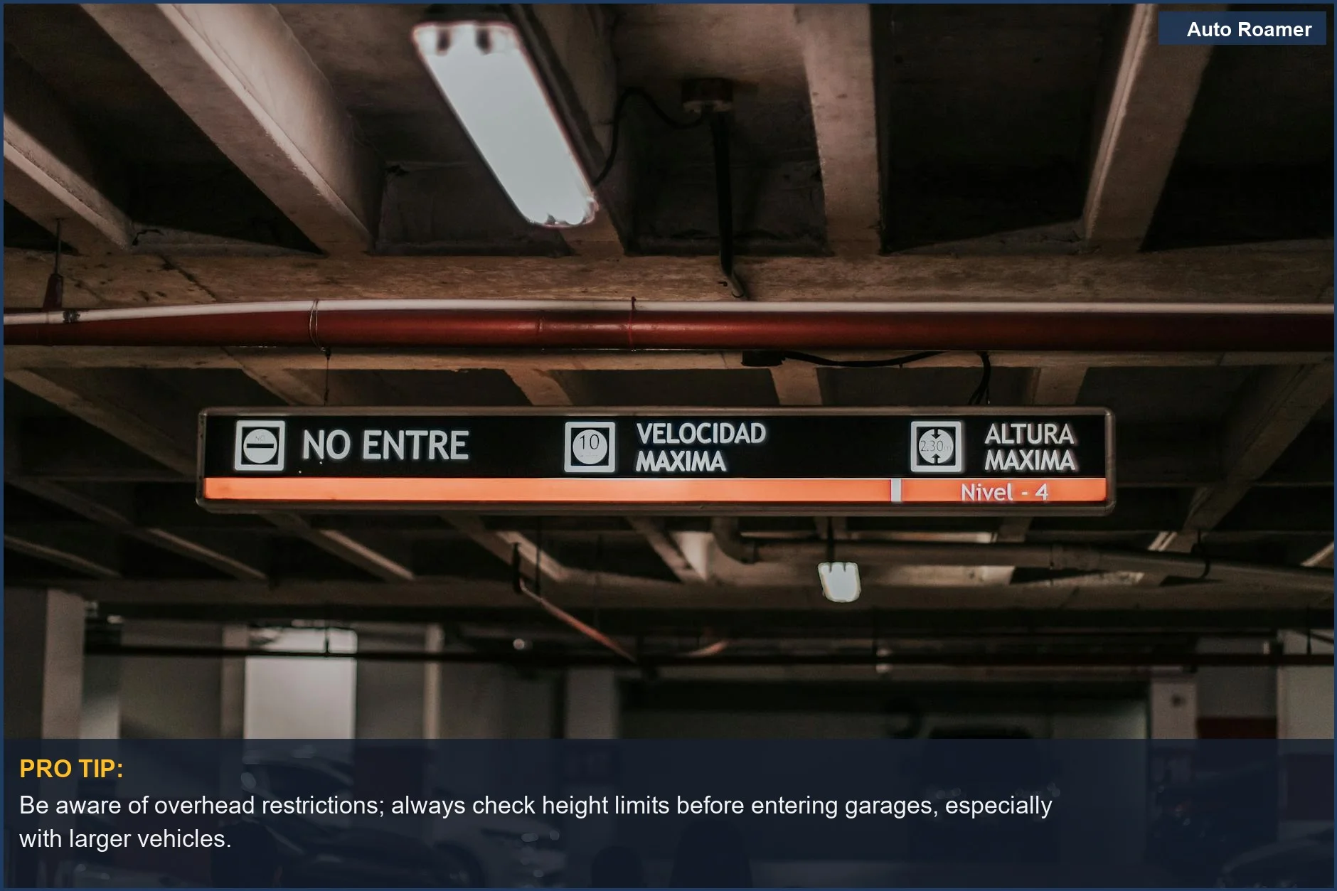 Interior of a parking garage with signage, emphasizing safety features like backup camera guidelines.