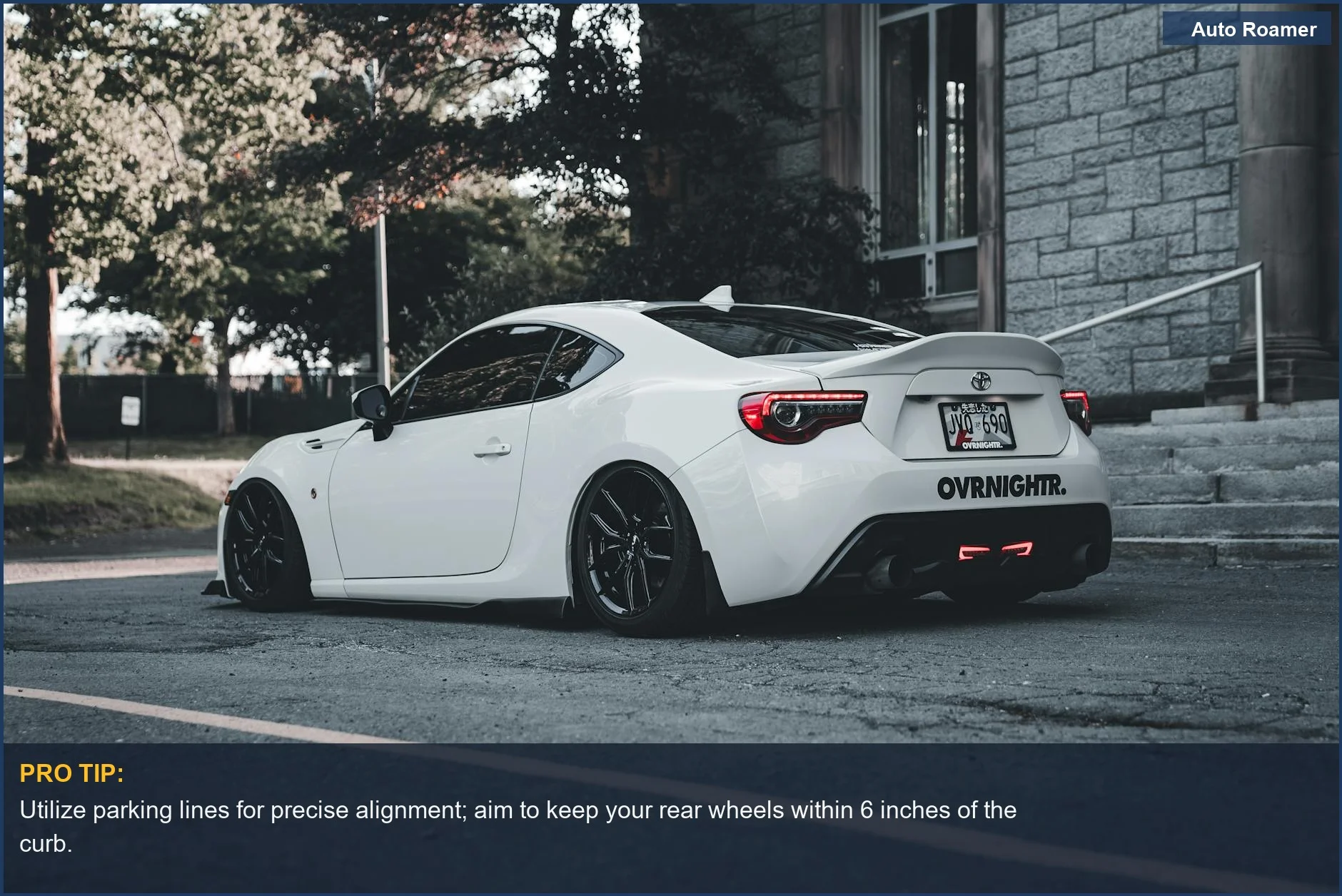 Modern white sports car parked outdoors, demonstrating the need for backup camera guidelines for safe parking.