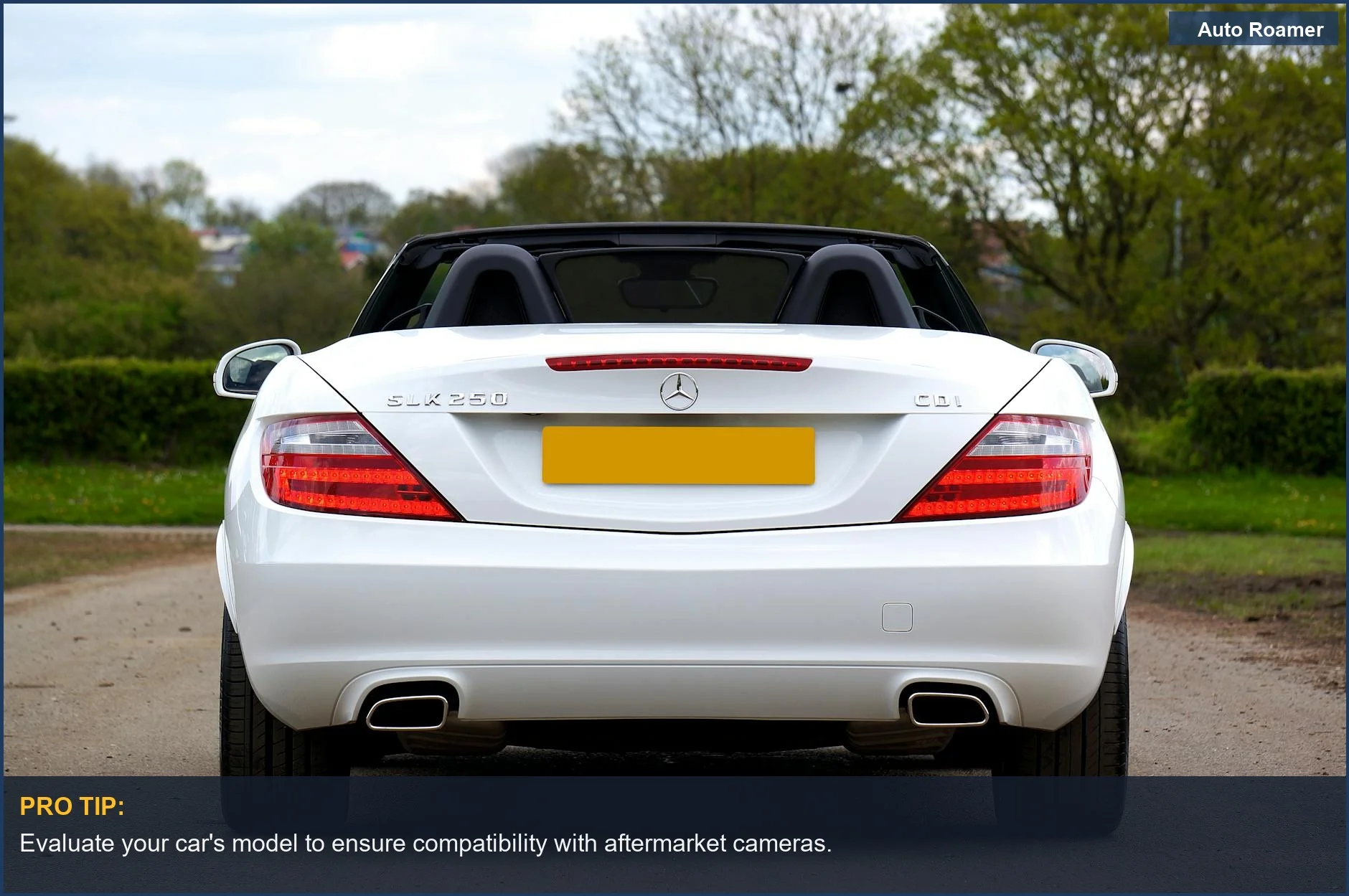 White Mercedes SLK250 parked outdoors, showcasing the potential for backup camera installation.