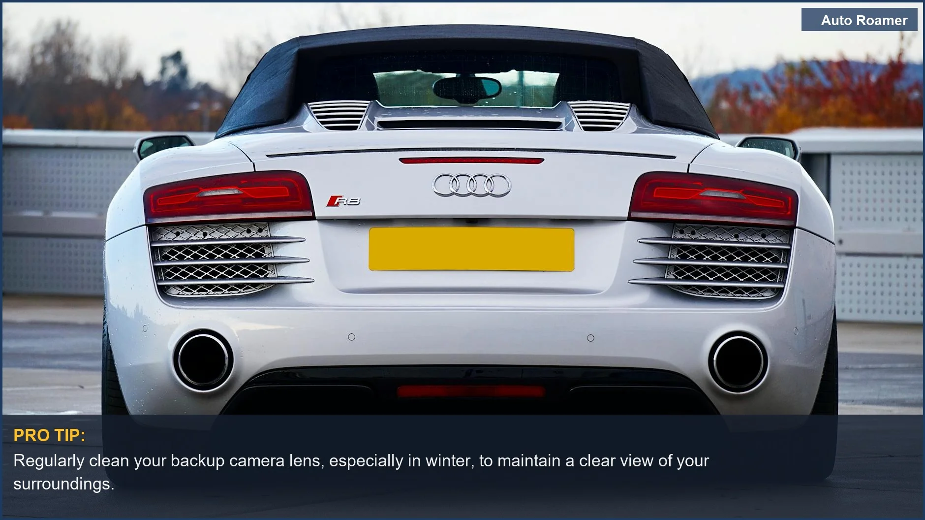 Sleek white sports car rear, highlighting taillights and the mandatory backup camera requirement in Canada.