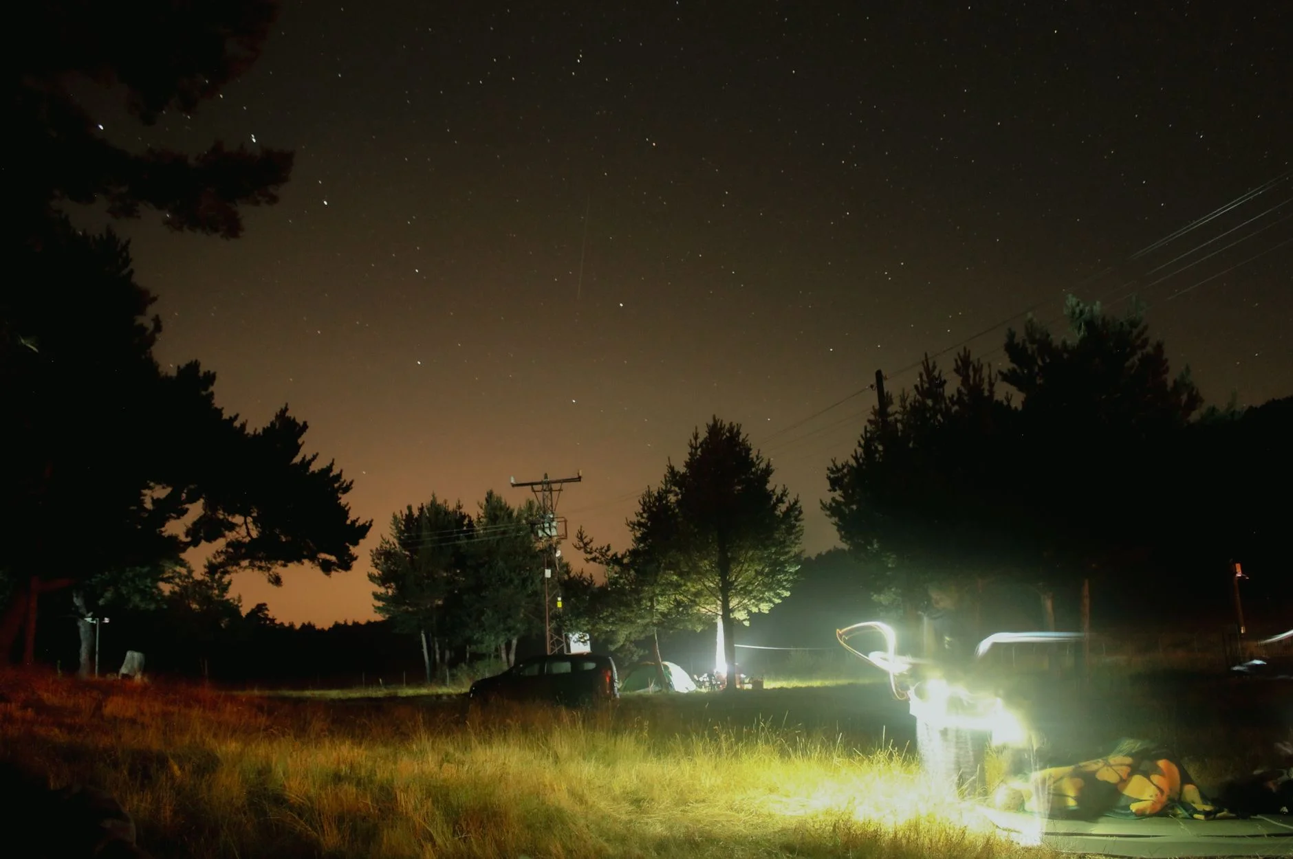 A rechargeable LED camping lantern lighting a tent at night, where runtime on a low ambient setting matters most.