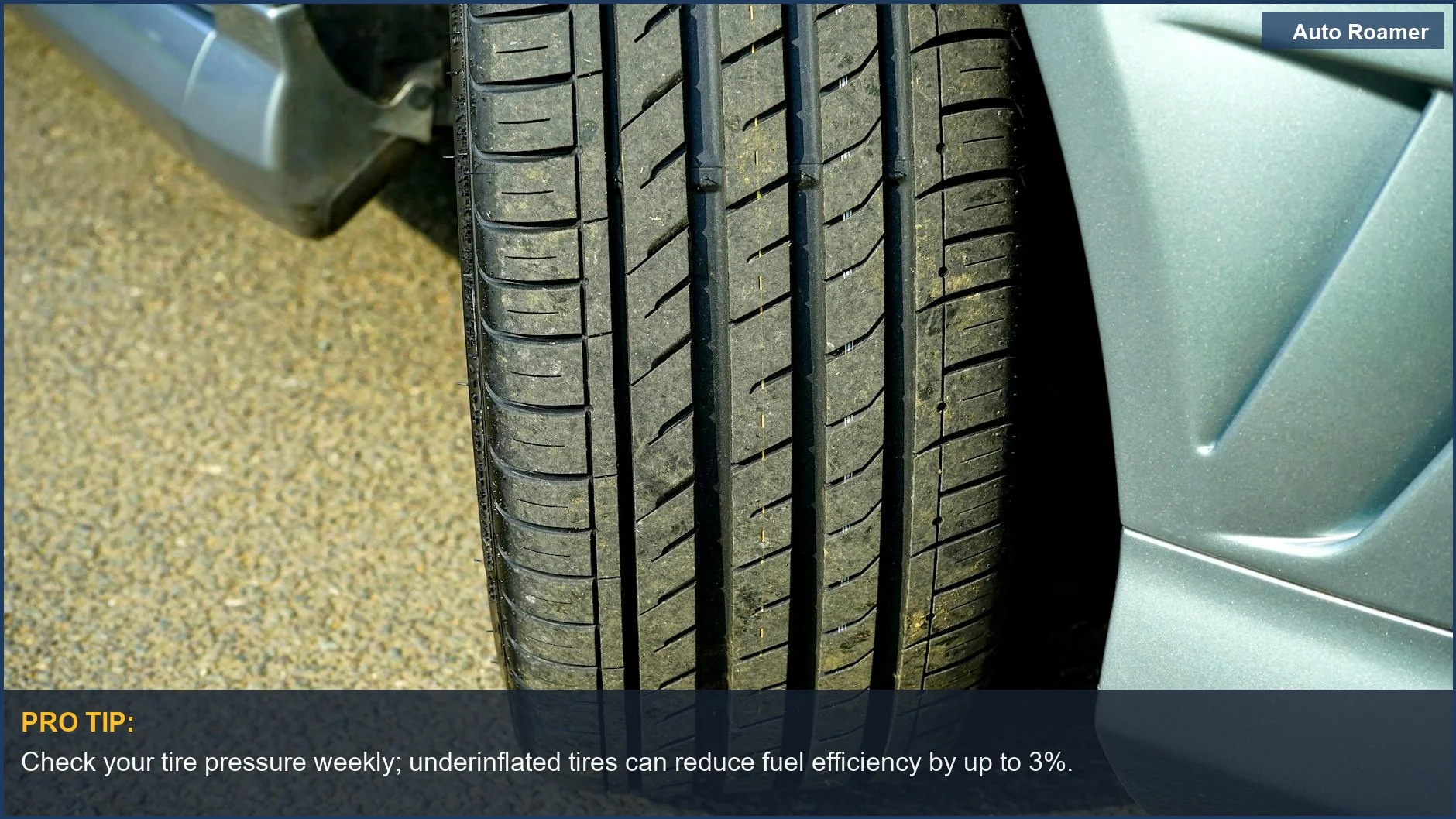Detailed car tire tread on asphalt, showcasing the importance of tire pressure for road trip safety.