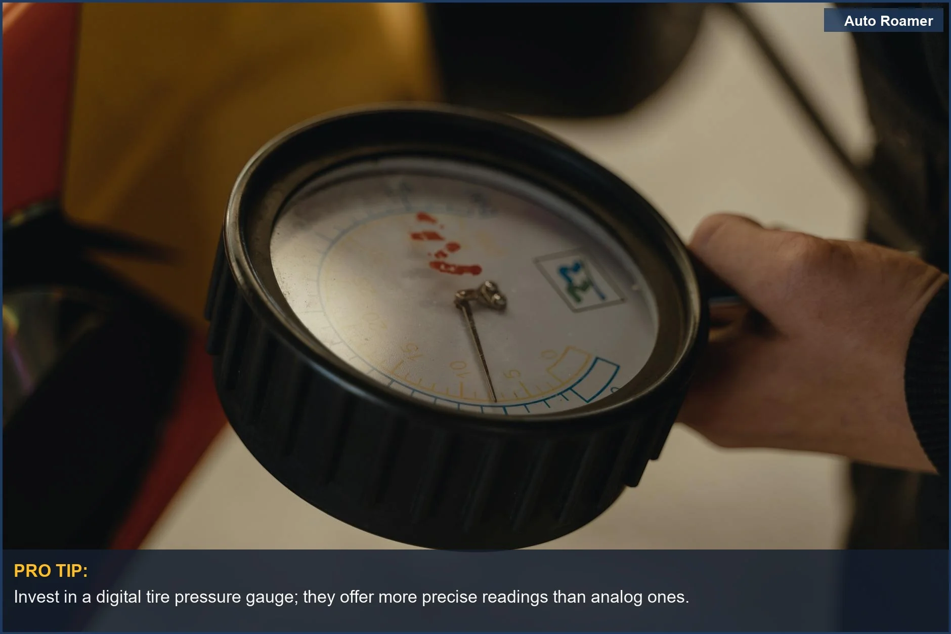 Close-up of a hand holding a tire pressure gauge, illustrating TPMS advantages for monitoring tire health.