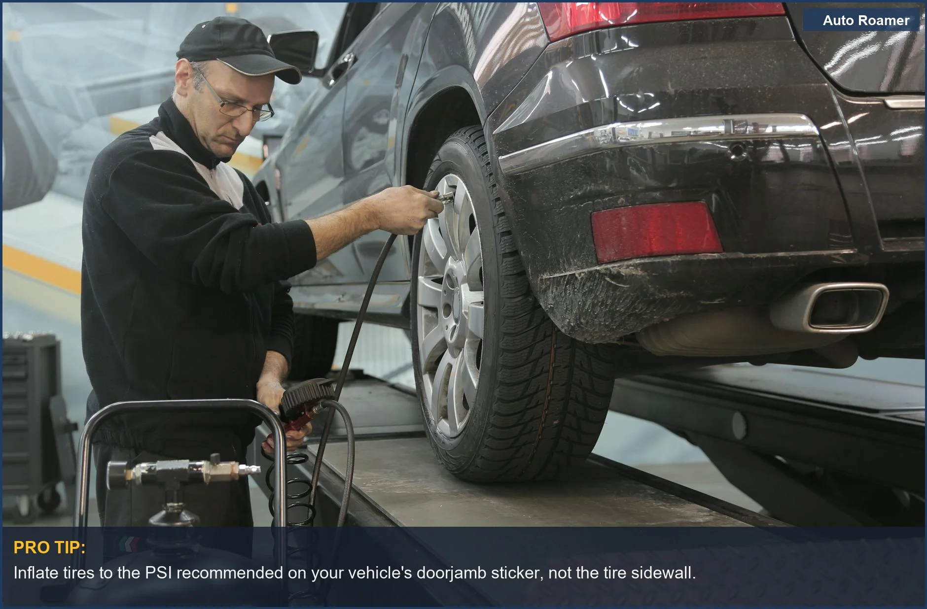 Auto mechanic inflating a car tire, highlighting TPMS benefits for preventing blowouts on long drives.