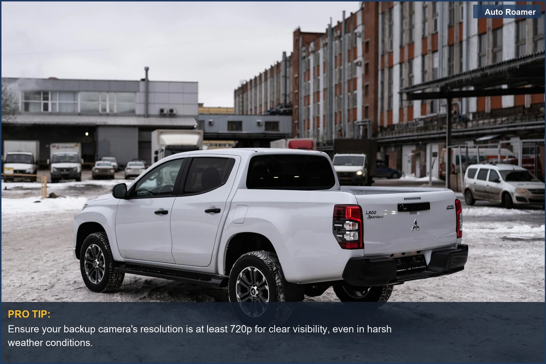 Reliable backup camera system for older trucks, showcasing a white pickup truck in a snowy urban environment.