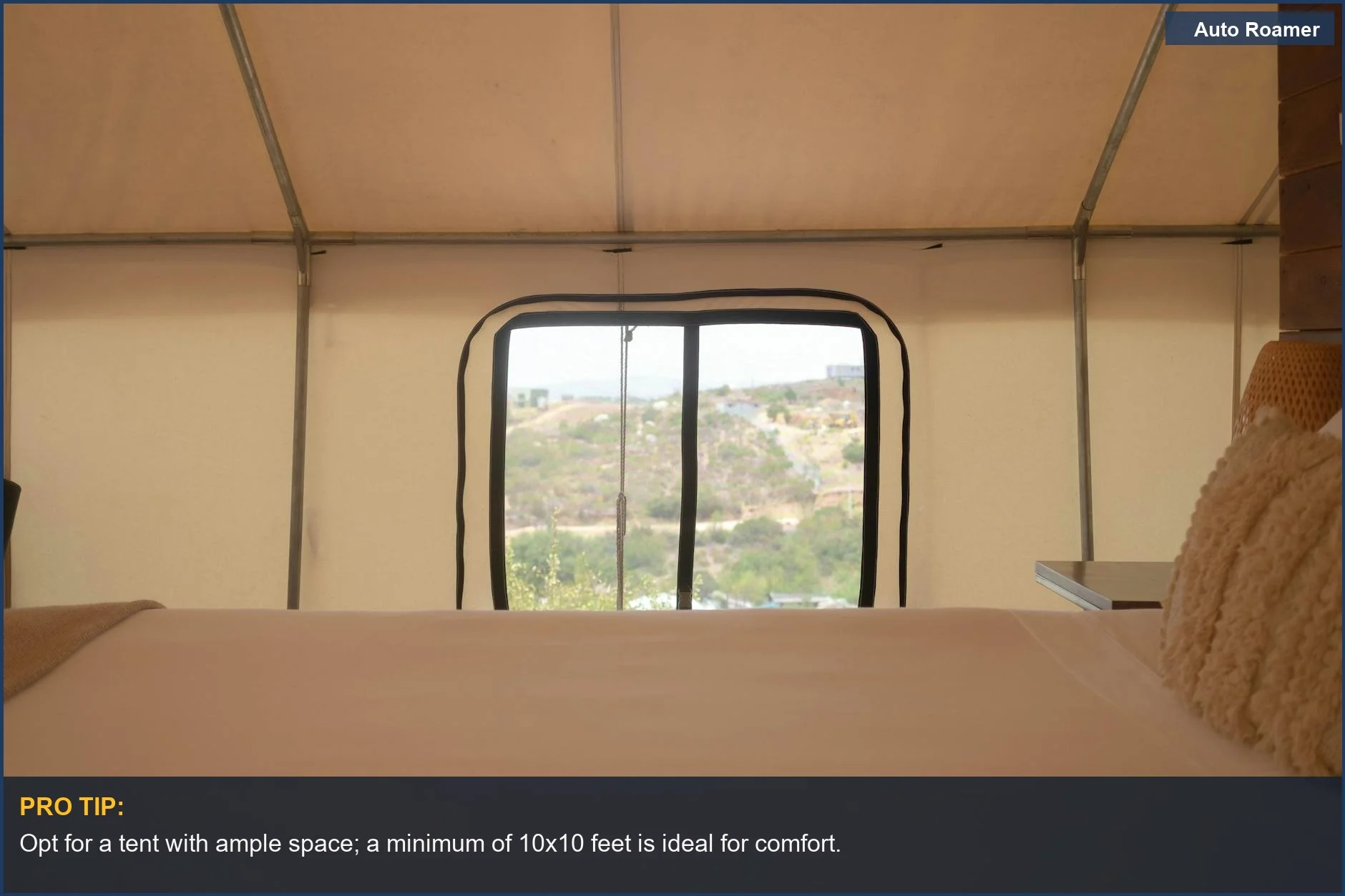 Cozy tent interior with serene landscape view, perfect for relaxation.