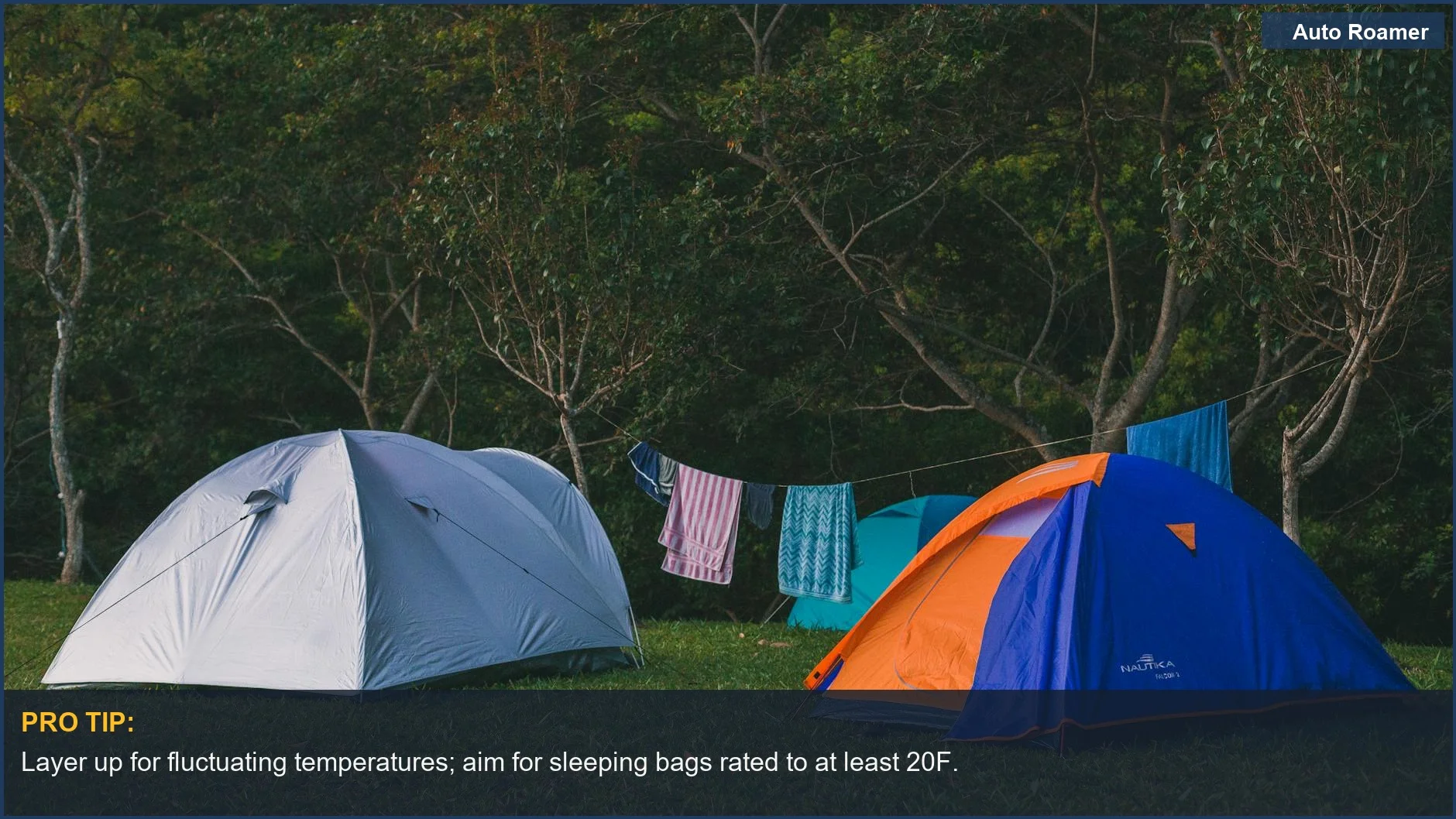 Camping tents and clothes drying on a line in a forest, showcasing basic SUV camping gear.