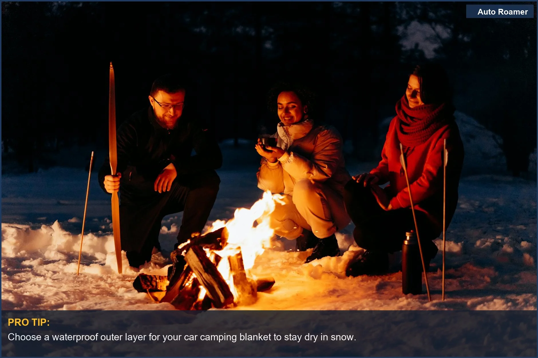 Friends gathered around a snowy campfire, showcasing warmth with a car camping blanket.