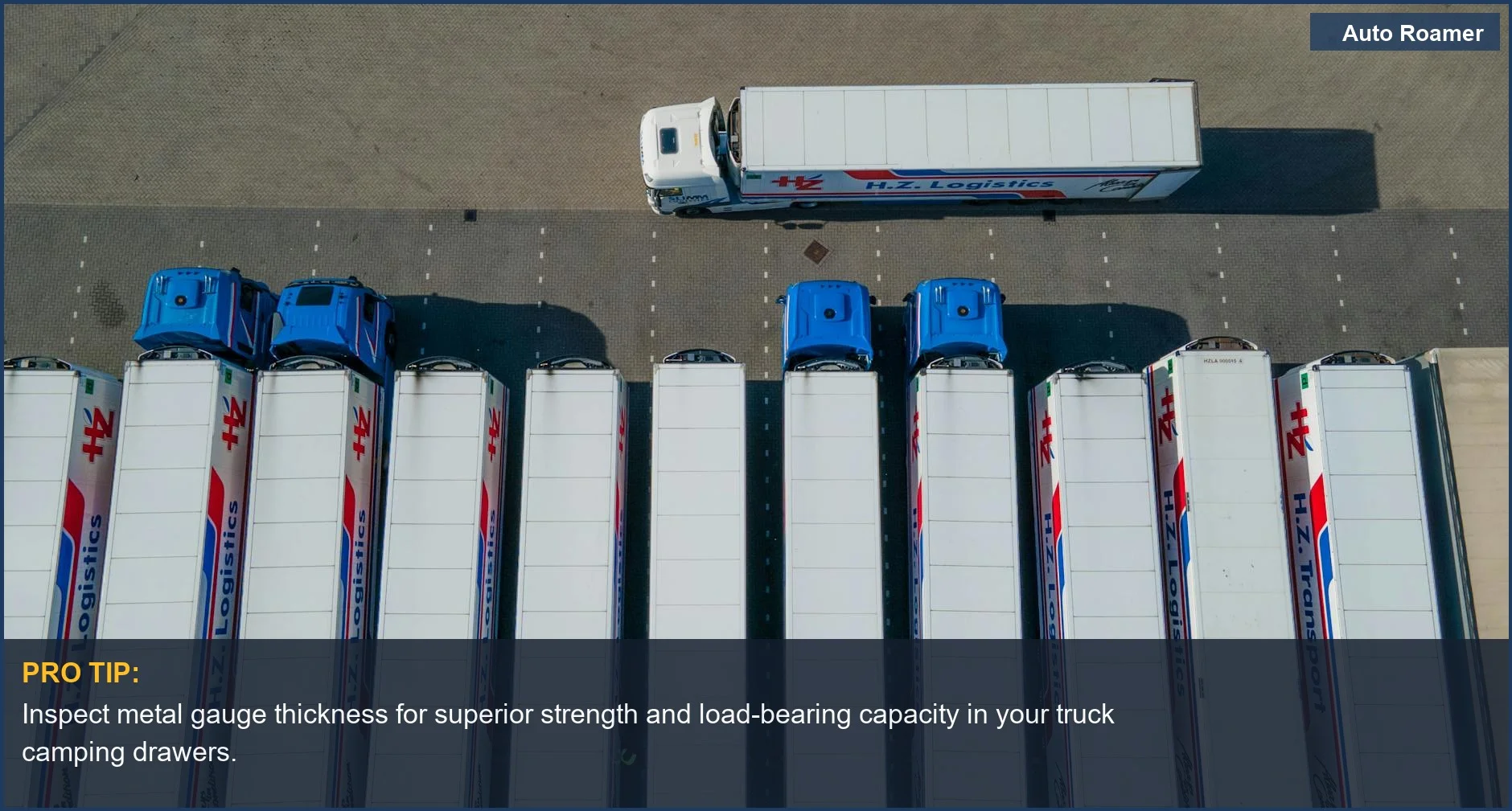 Industrial logistics trucks in a parking lot, highlighting the robust engineering needed for a truck bed drawer system.