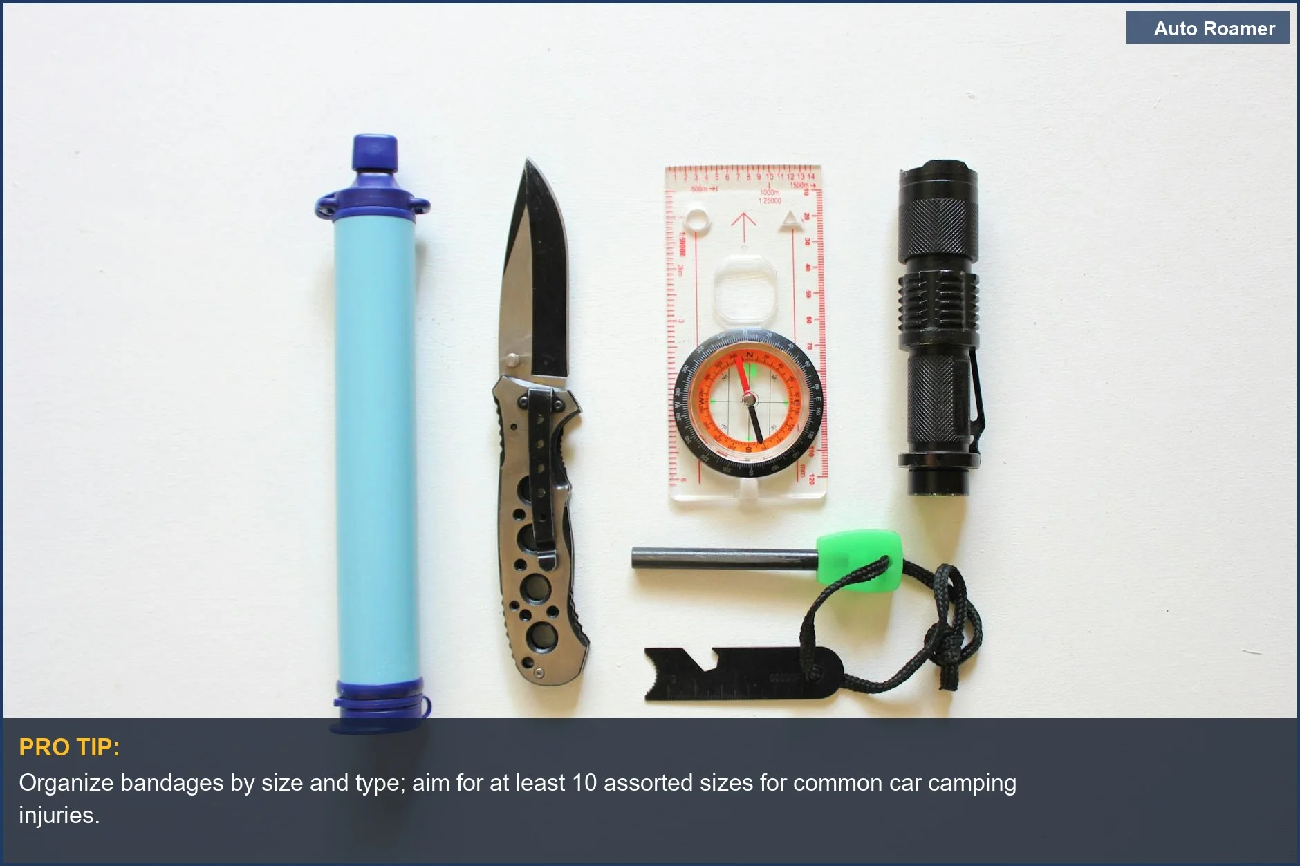 Essential car camping first aid kit contents laid out neatly on a white surface, showing preparedness for outdoor emergencies.