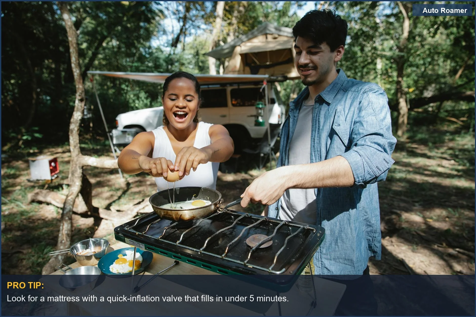 Couple cooking breakfast while car camping, demonstrating the ease of use of a quality two-person mattress.