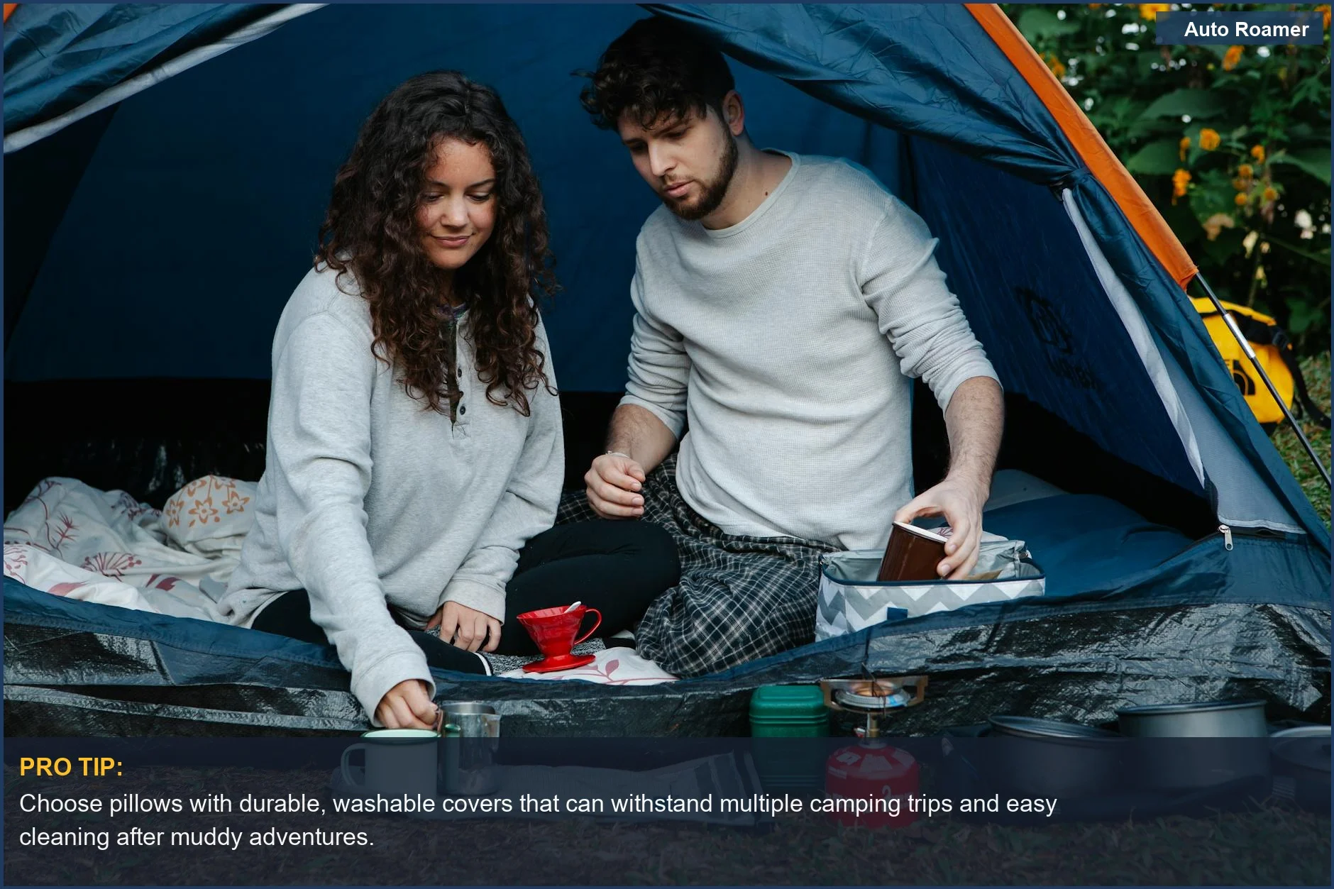 Young couple enjoying morning coffee inside a tent on a camping trip, highlighting the comfort of car camping.