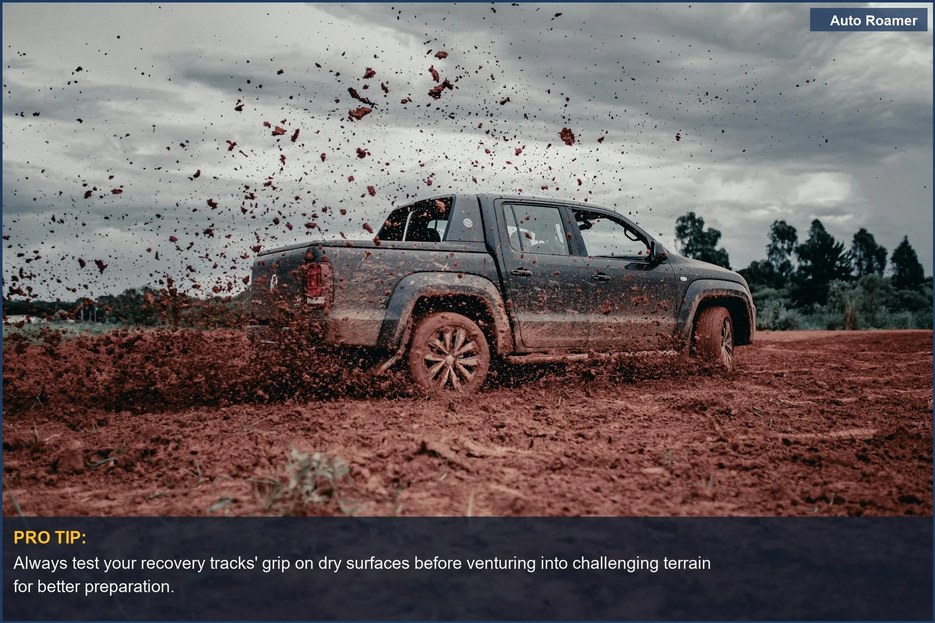 Pickup truck splashing through deep mud, showcasing the thrill of off-road driving with high-performance overlanding recovery tracks.