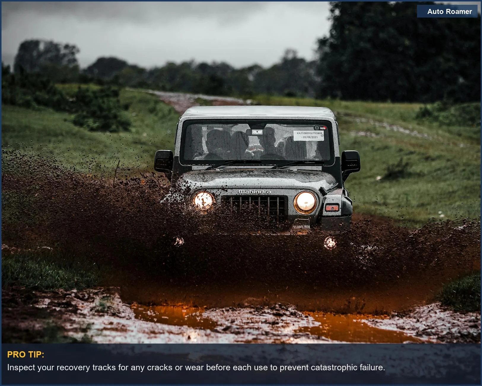 Powerful off-road vehicle powering through water and mud on a difficult trail, emphasizing reliable car camping recovery solutions.