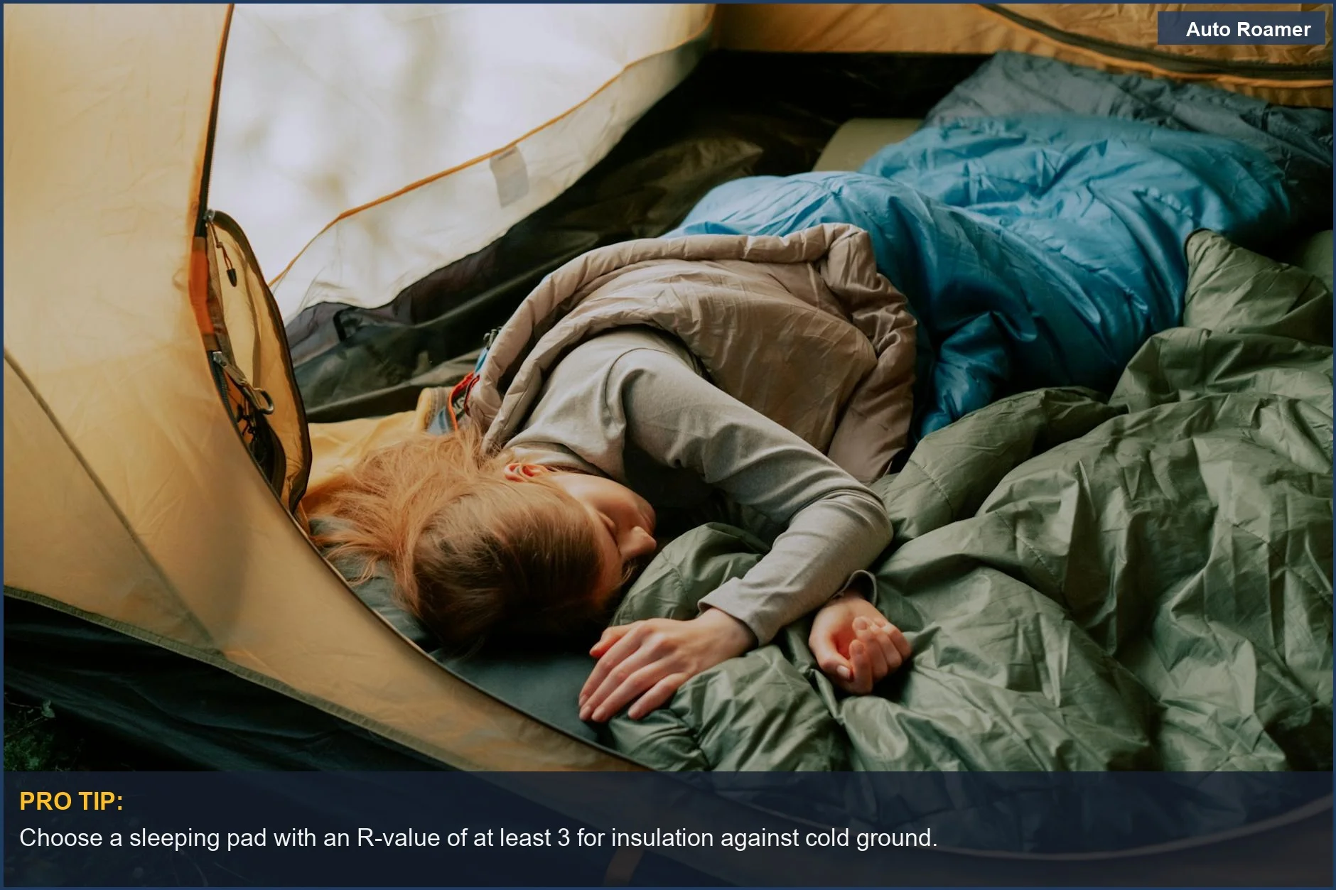 Woman sleeping soundly in a tent, demonstrating a comfortable car camping sleep system amidst nature.