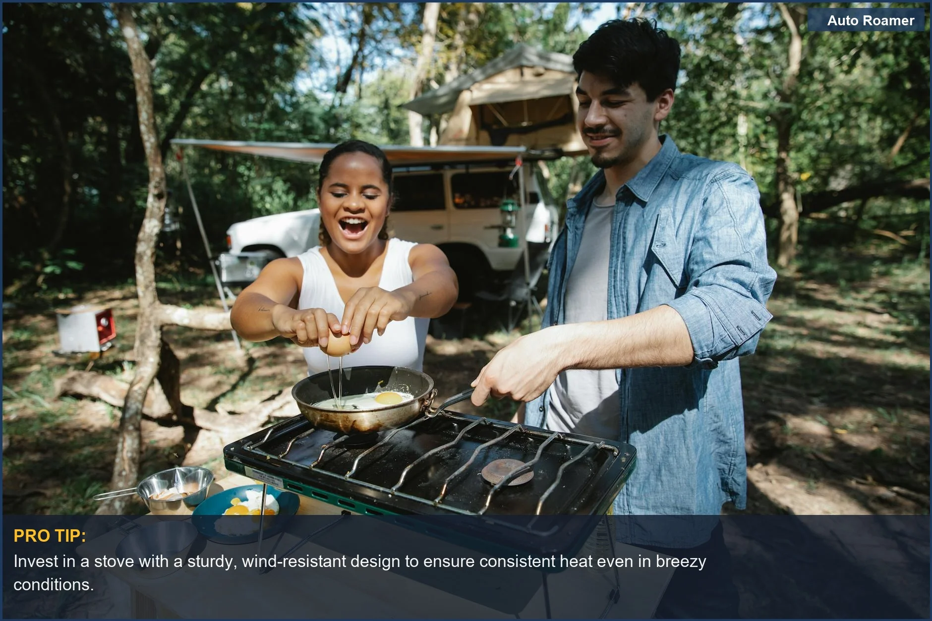 Couple frying eggs on a beginner car camping stove near their car and tent in a forest.