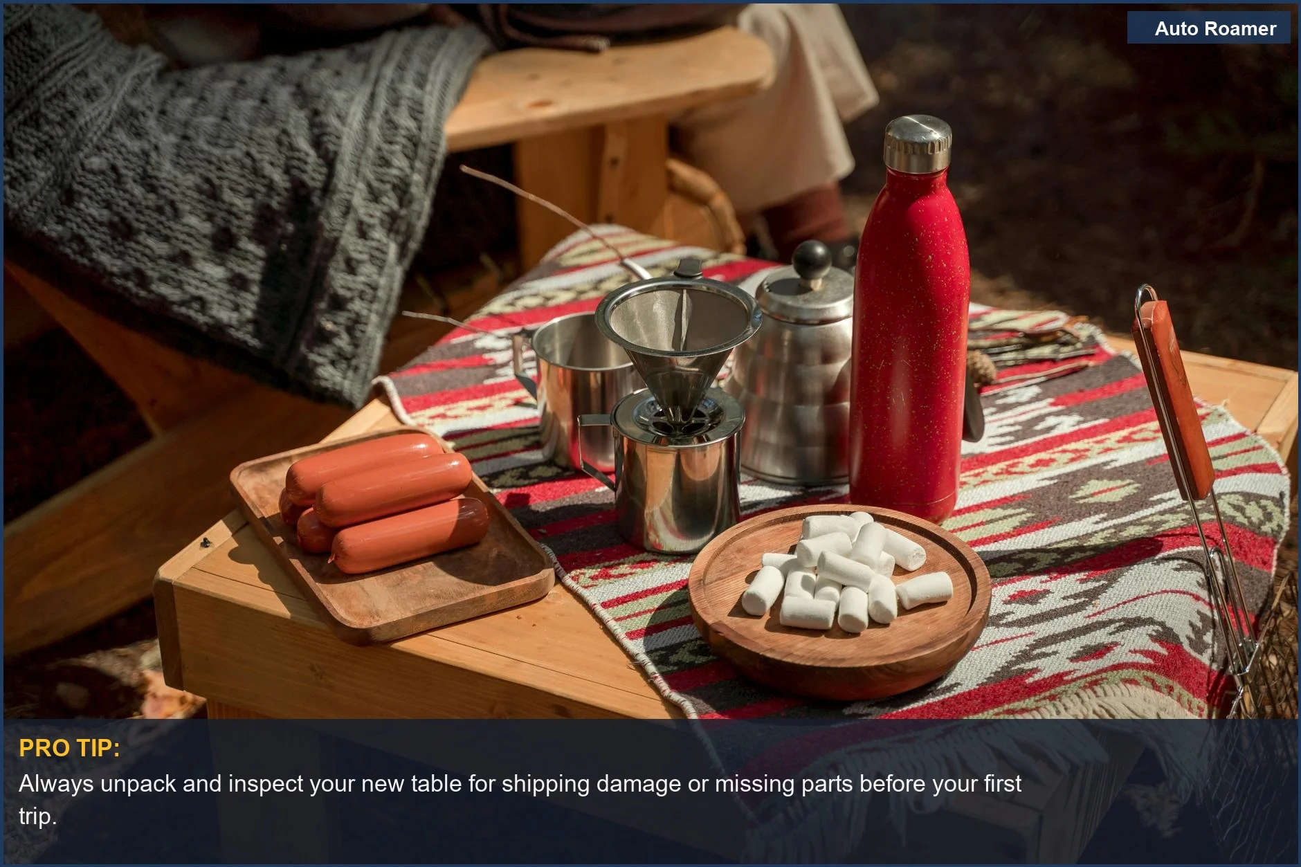 Warm picnic scene with sausages, marshmallows, and coffee on a wooden car camping table.